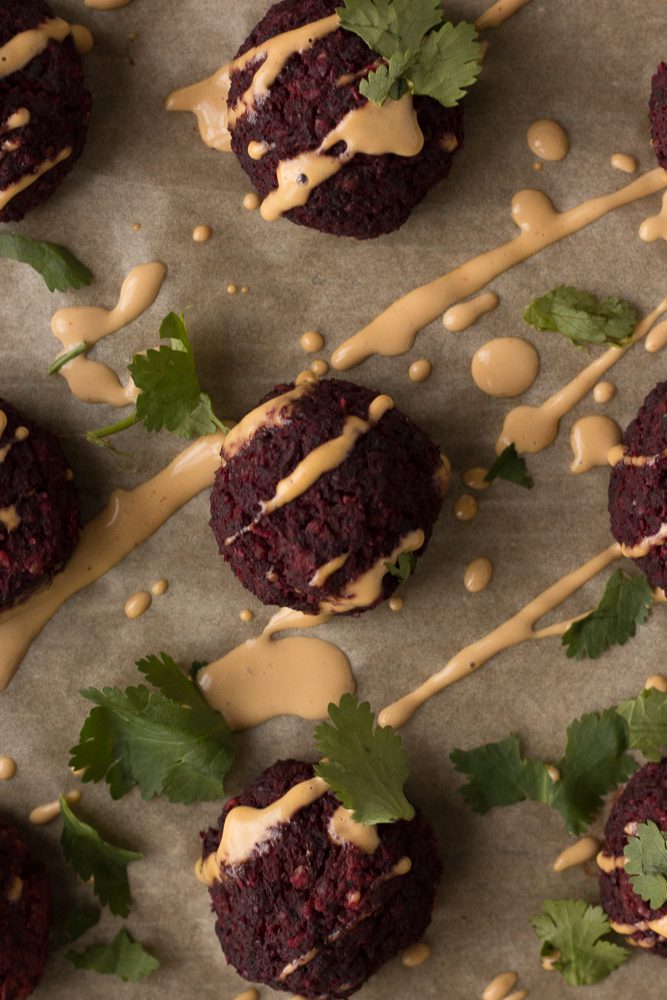 Lentil Walnut Beet Balls drizzled with Spicy Tahini Dressing by Flora & Vino