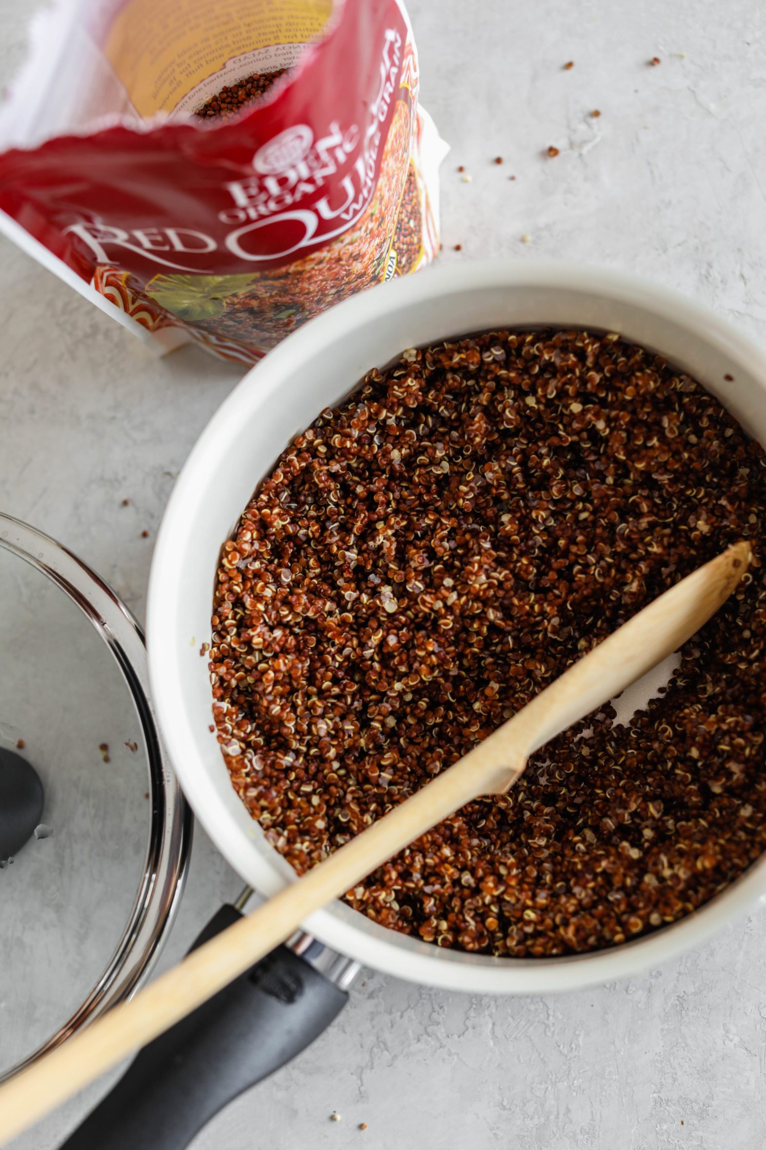 Eden Foods Red Quinoa in pot with wooden spoon by Flora & Vino