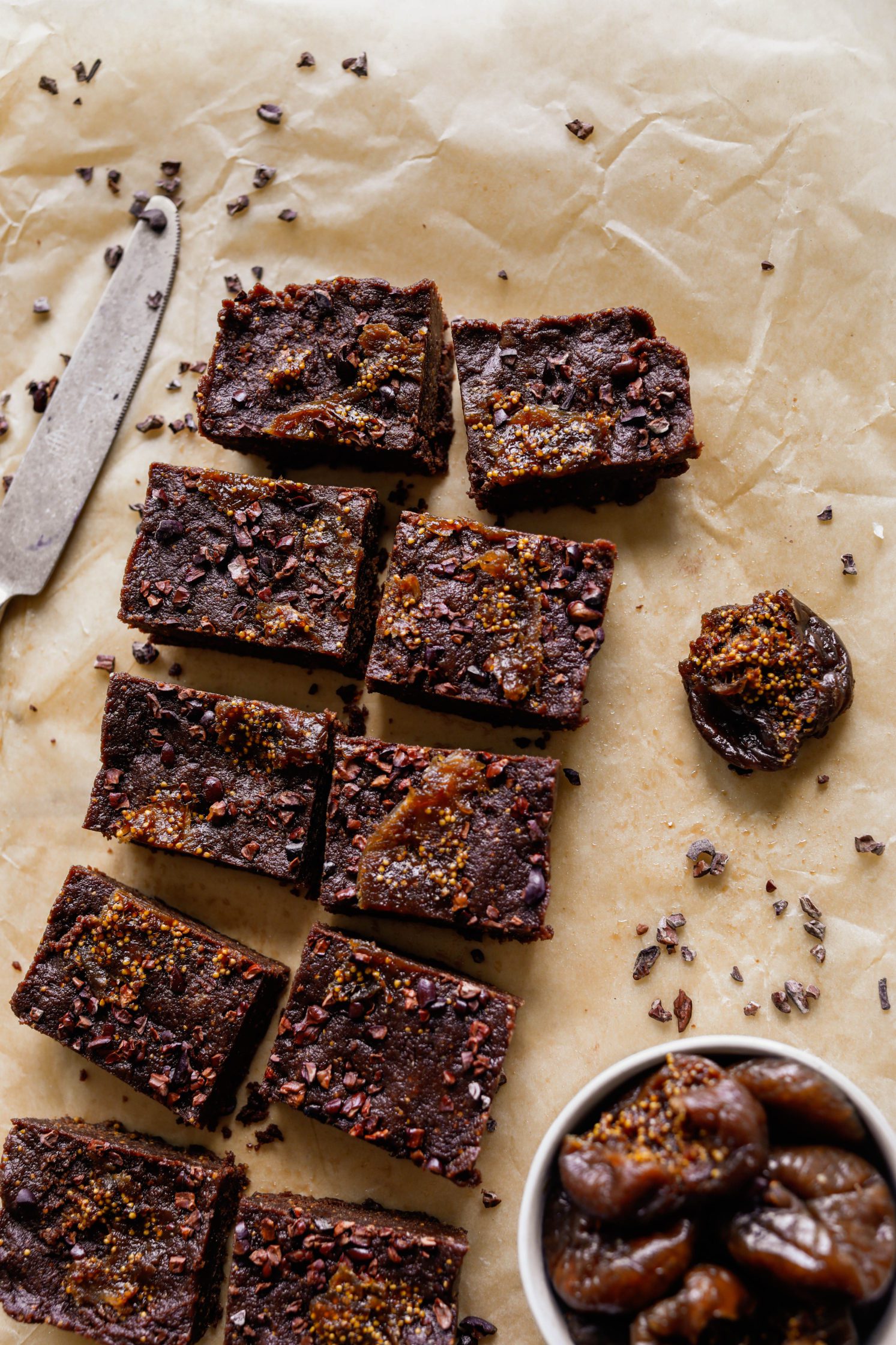 Chocolate Fig Freezer Fudge sliced on parchment paper by Flora & Vino 