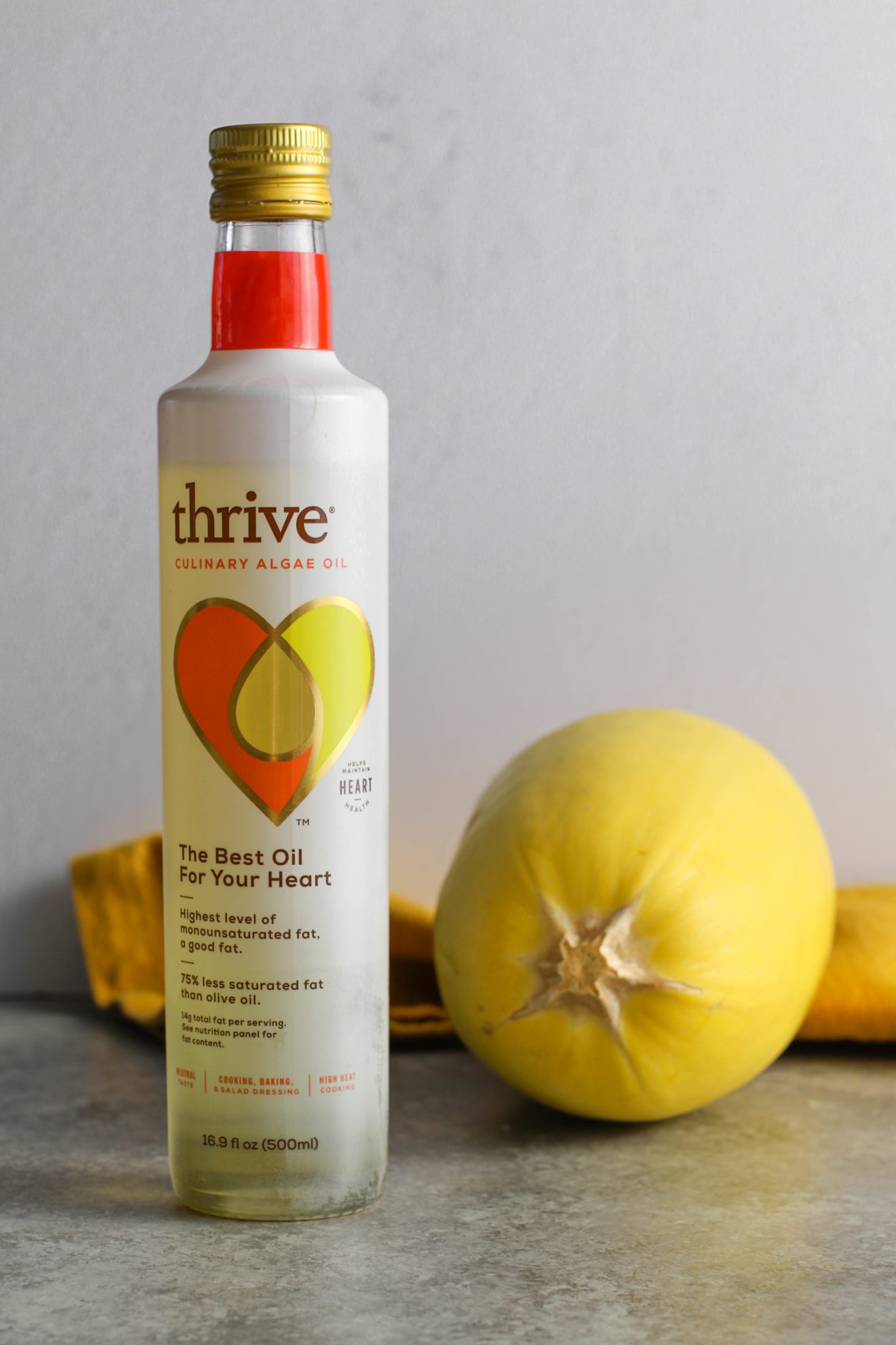 Thrive Culinary Algae Oil with a spaghetti squash next to it by Flora & Vino