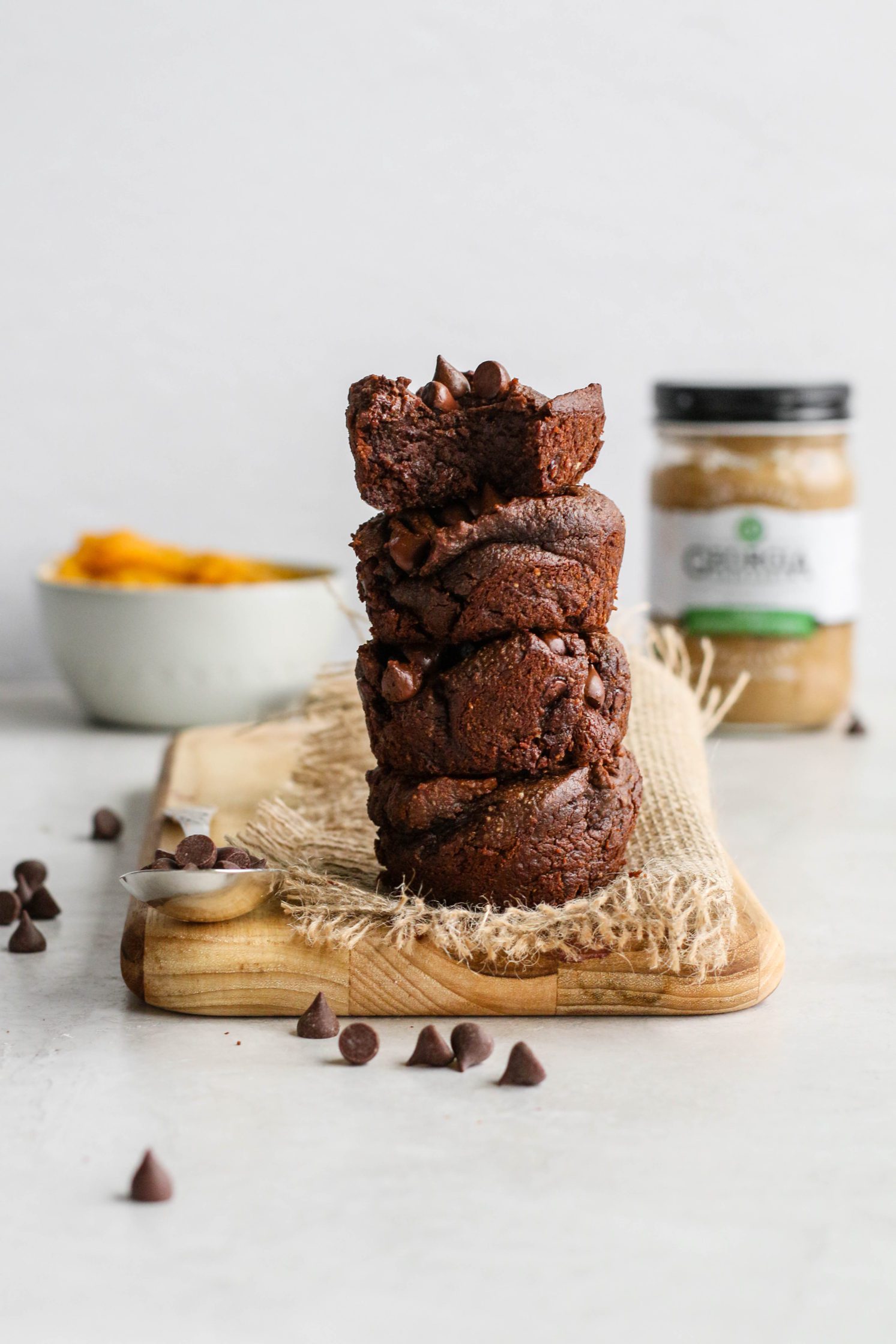 1-Bowl Butternut Brownies stacked on wooden board by Flora & Vino