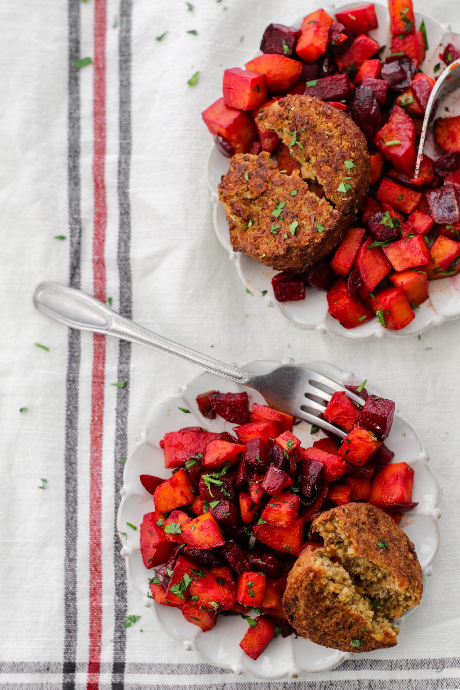 Sweet Potato & Beet Breakfast Hash served on white plates with forks