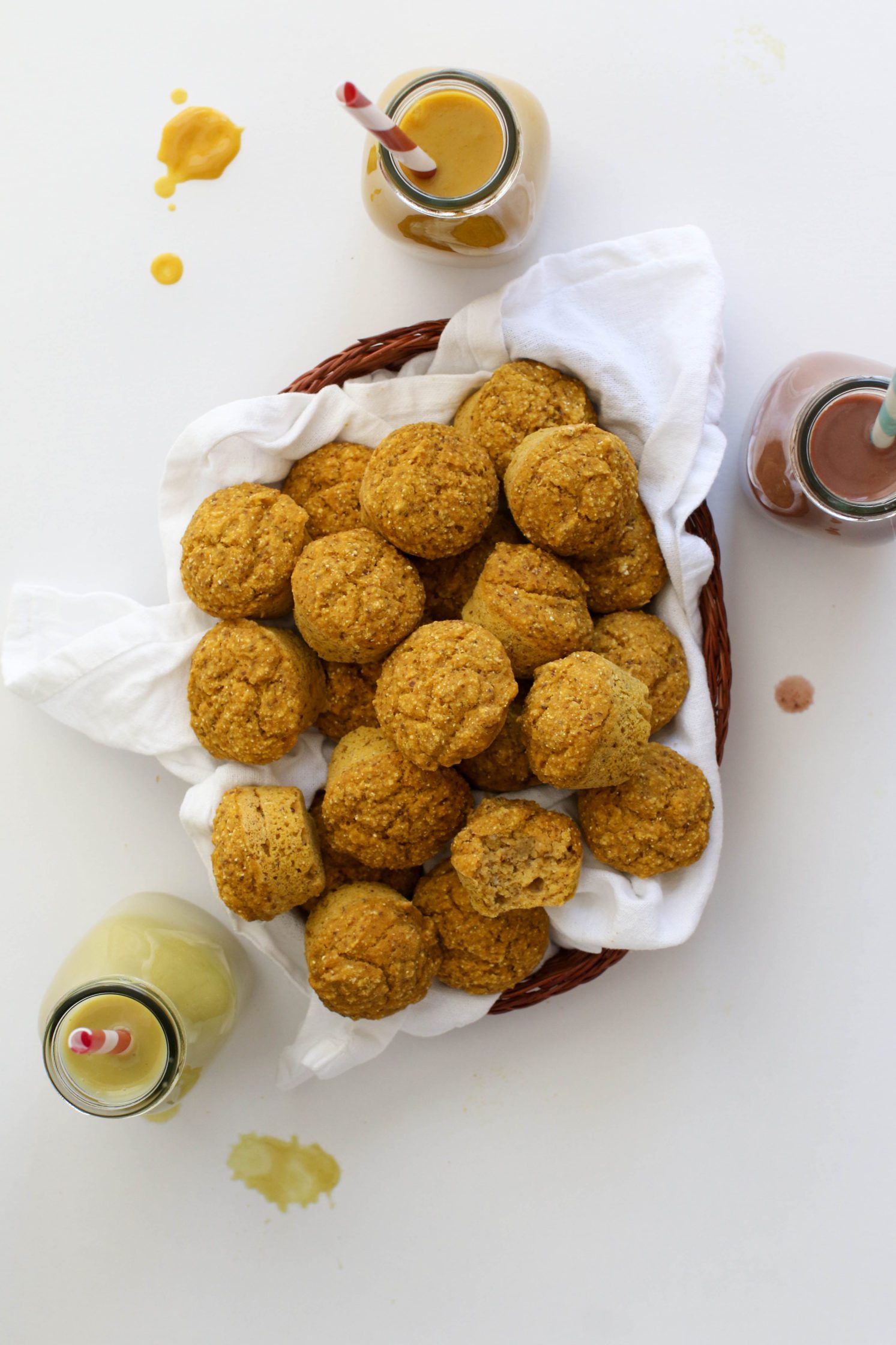 Pumpkin Cornbread Mini Muffins served in woven basket with white towel