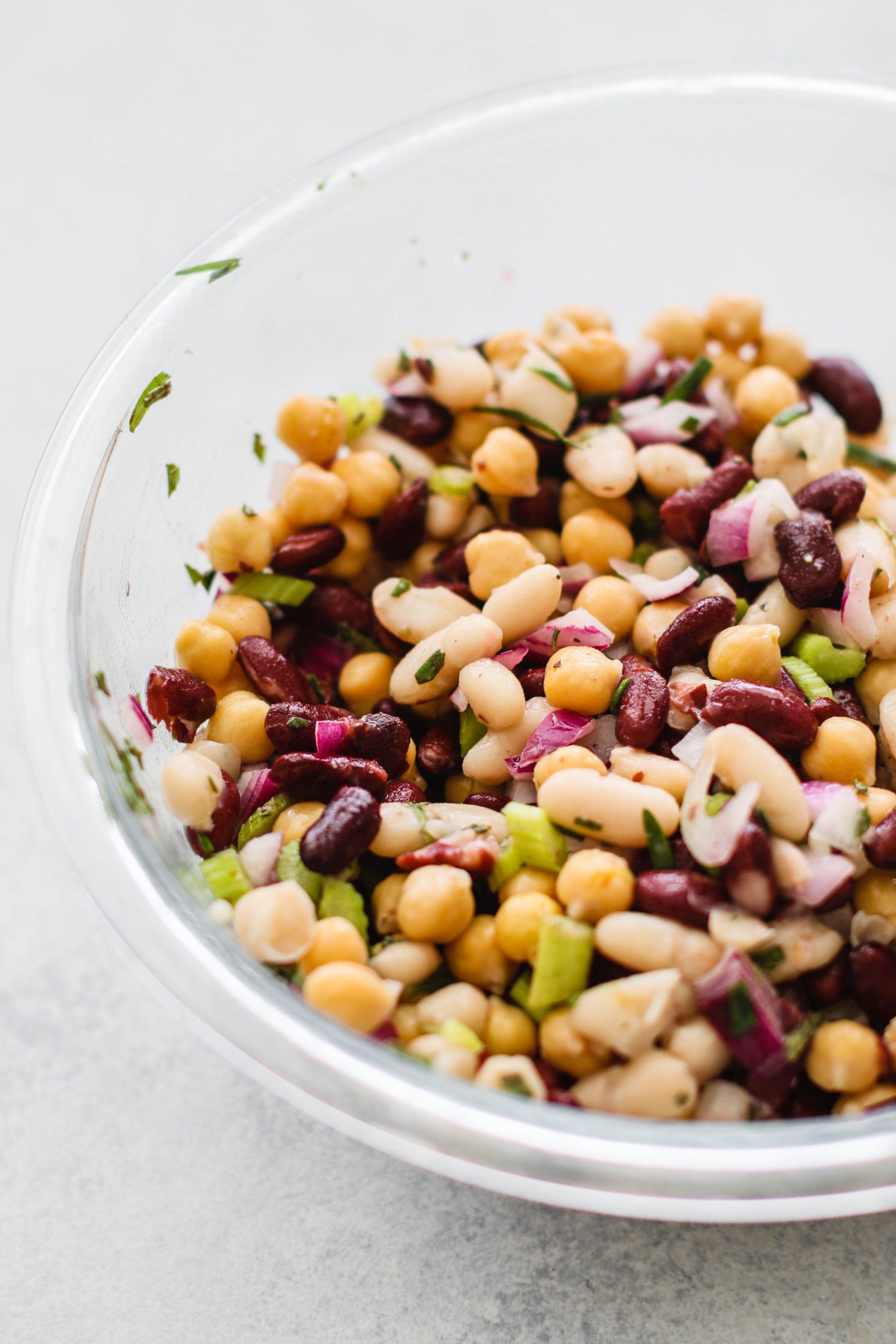 Rosemary Three Bean Salad mixed in glass bowl