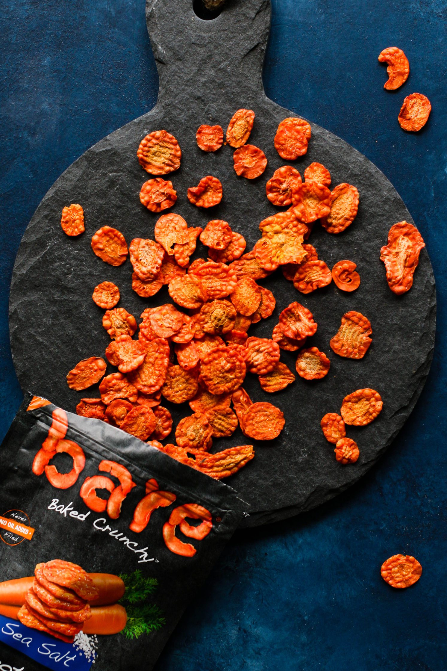 carrot chips on serving board by Flora & Vino