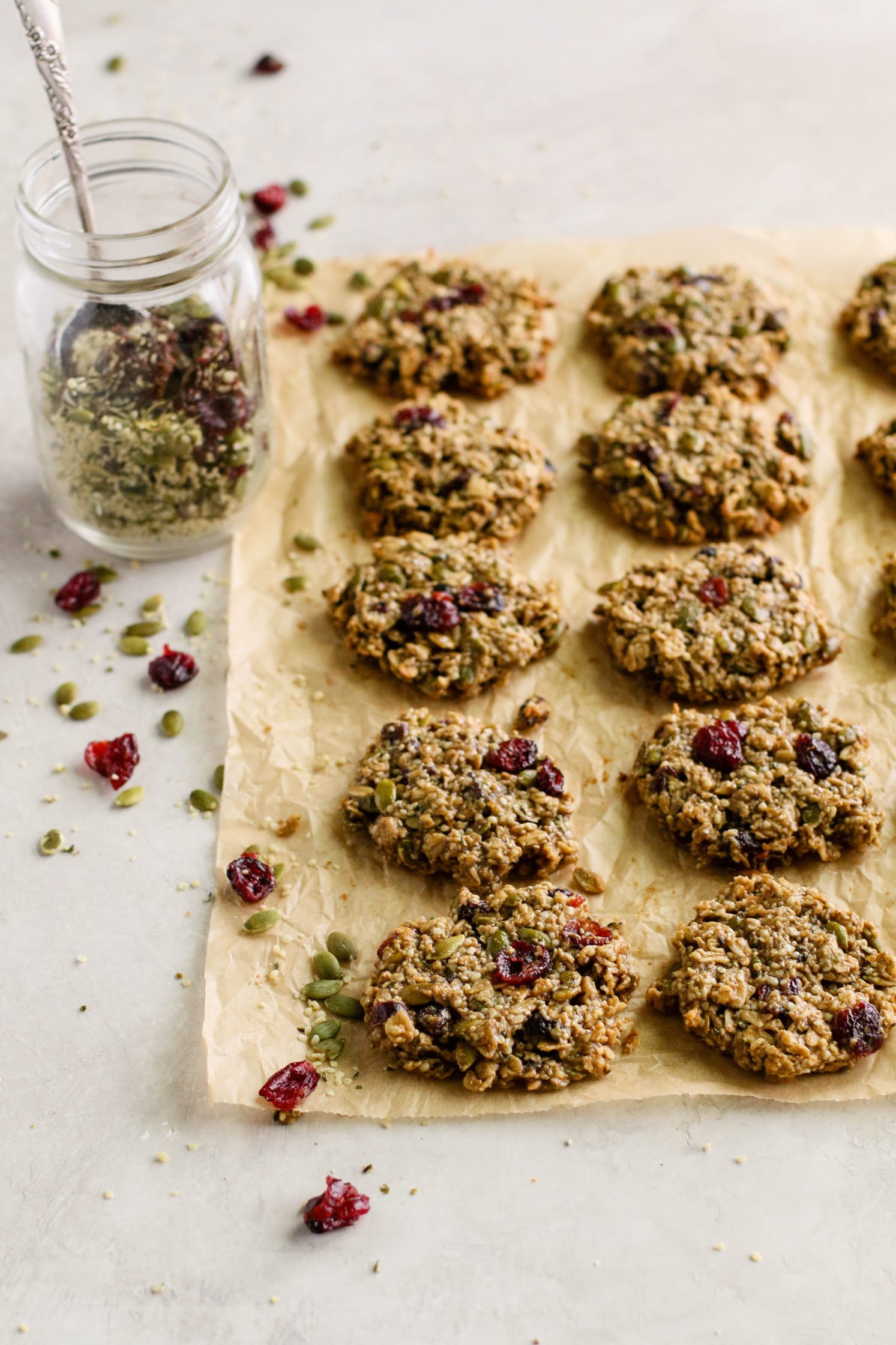 Healthy Trail Mix Cookies served on parchment paper with trail mix by Flora & Vino