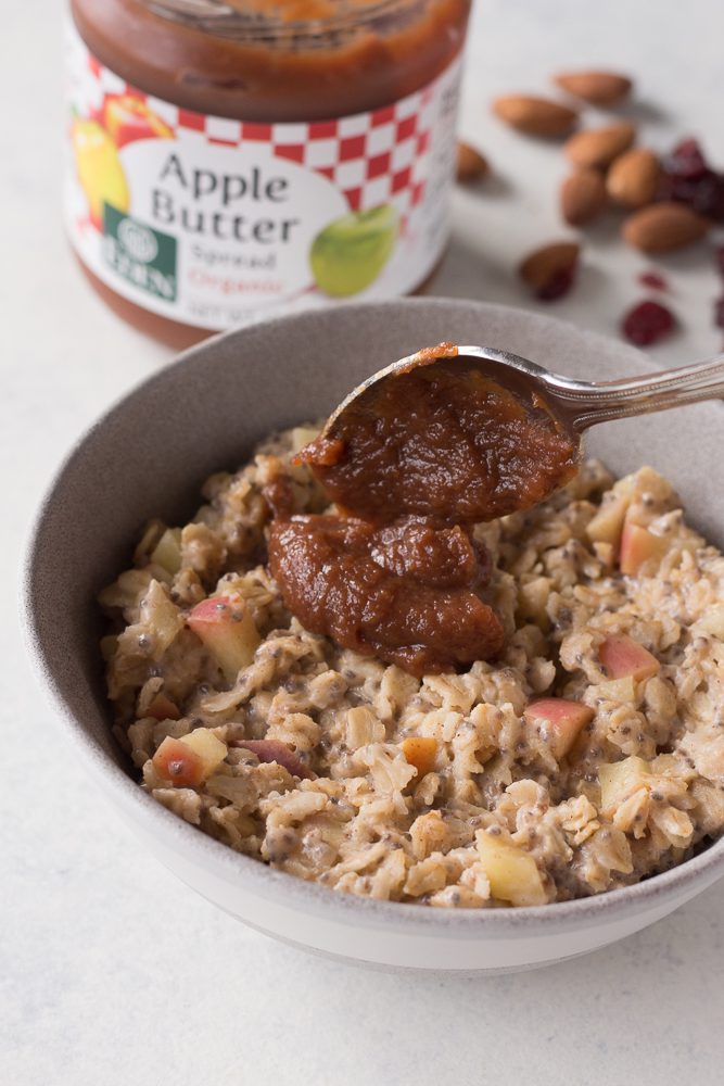 Apple Butter Stovetop Oats with apple butter spooned on top by Flora & Vino