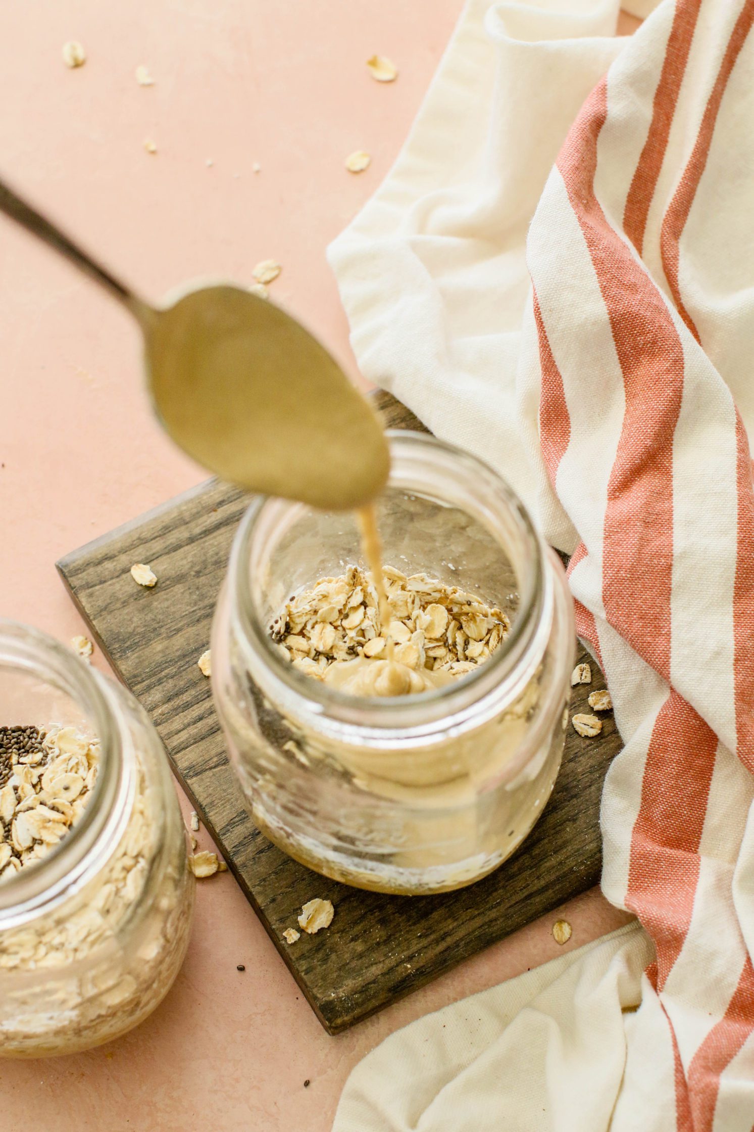 oatmeal in mason jars drizzled with tahini by Flora & Vino
