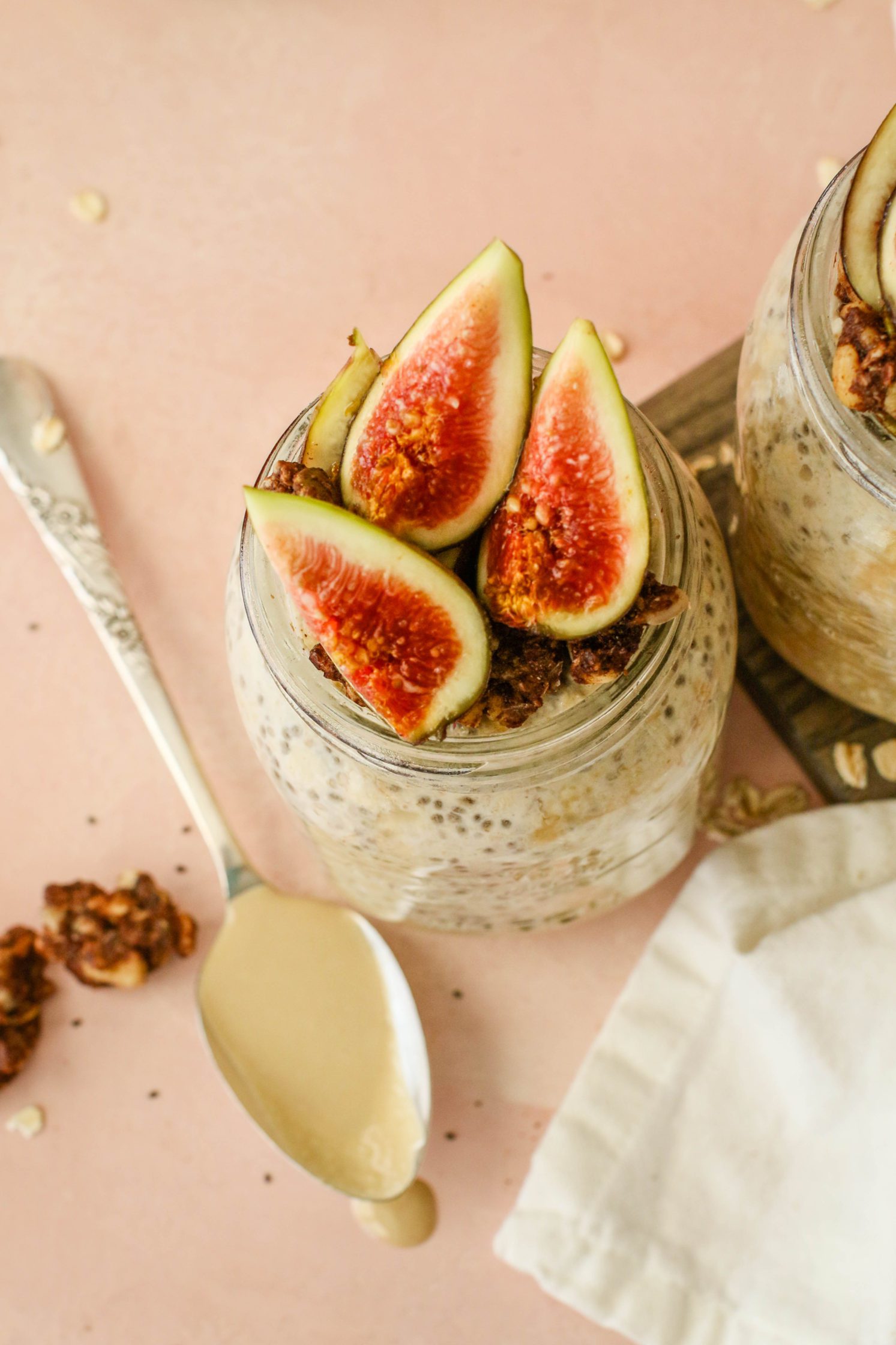 Maple Tahini Overnight Oats in mason oats topped with figs, granola, and tahini by Flora & Vino