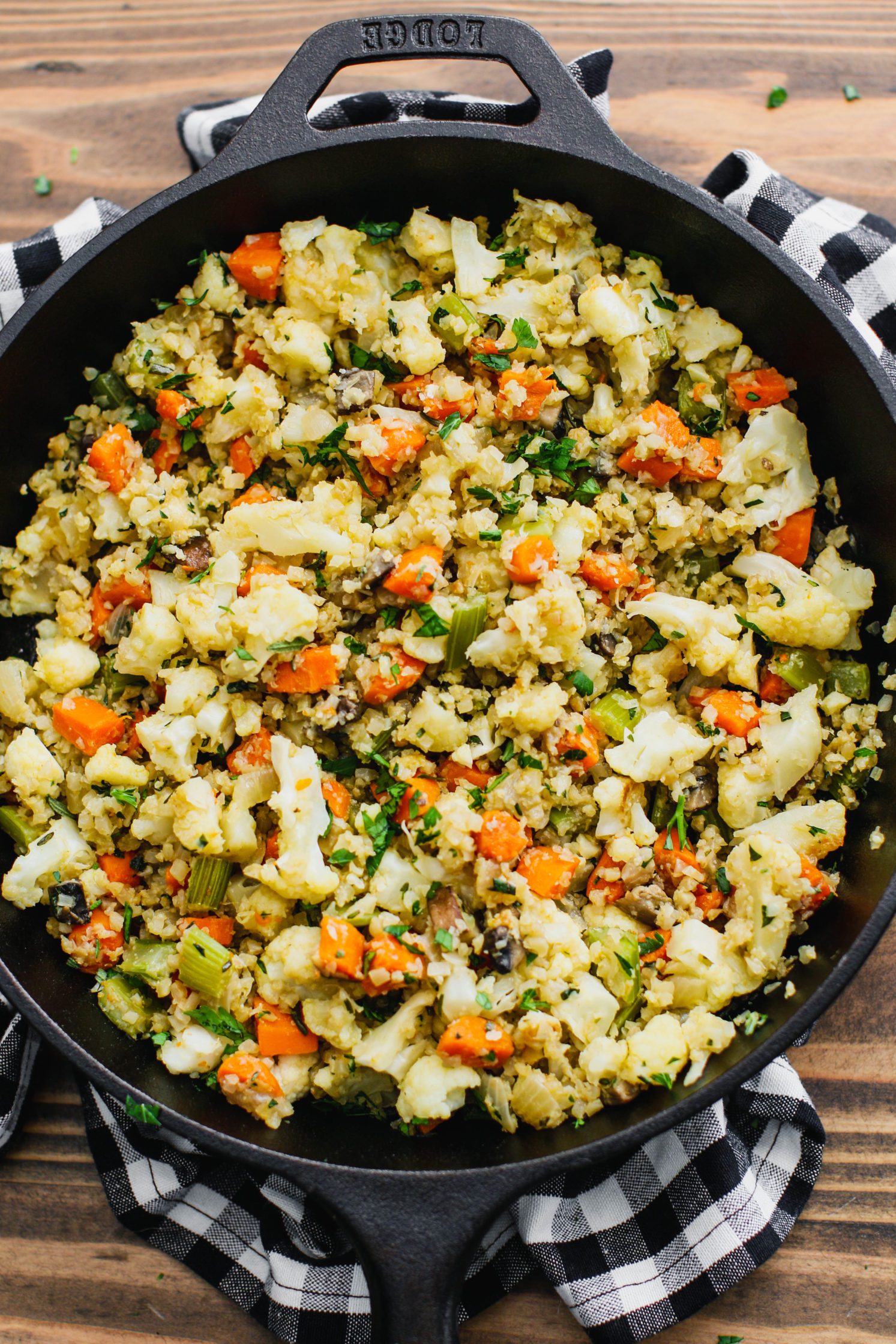 Stovetop Cauliflower Rice Stuffing in cast iron skillet by Flora & Vino