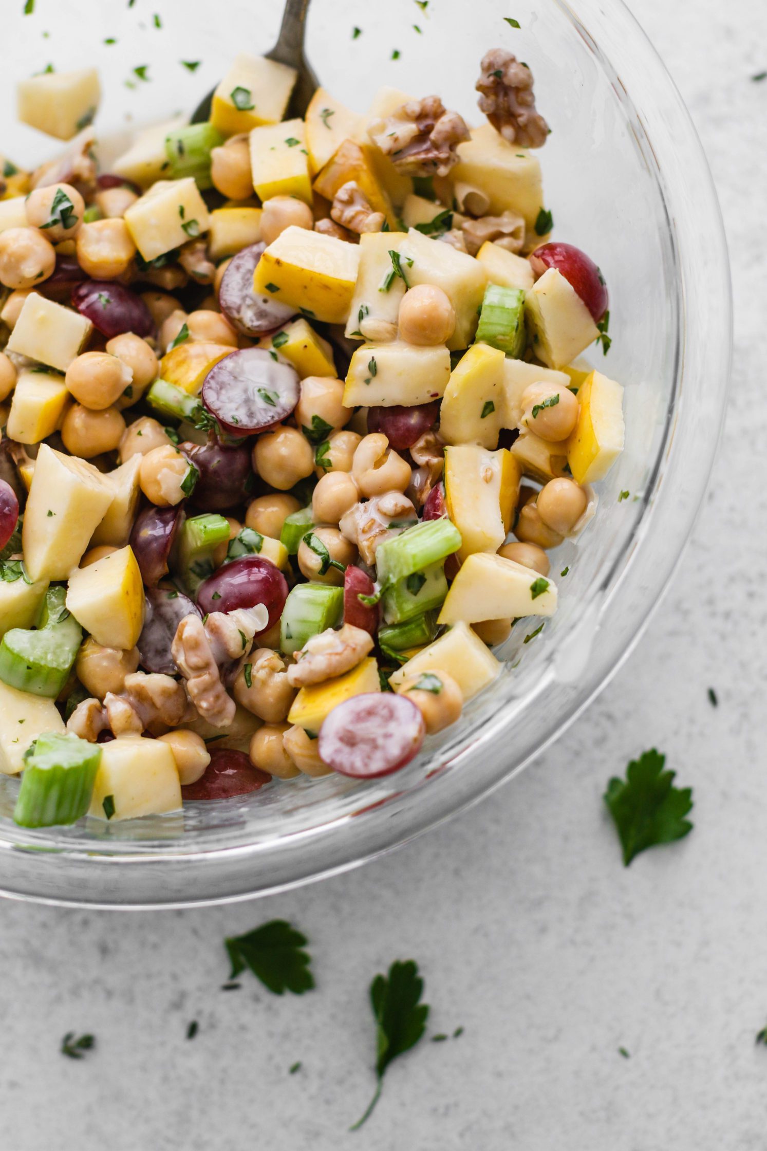 Chickpea Waldorf Salad mixed in bowl with Creamy Kombucha Dressing