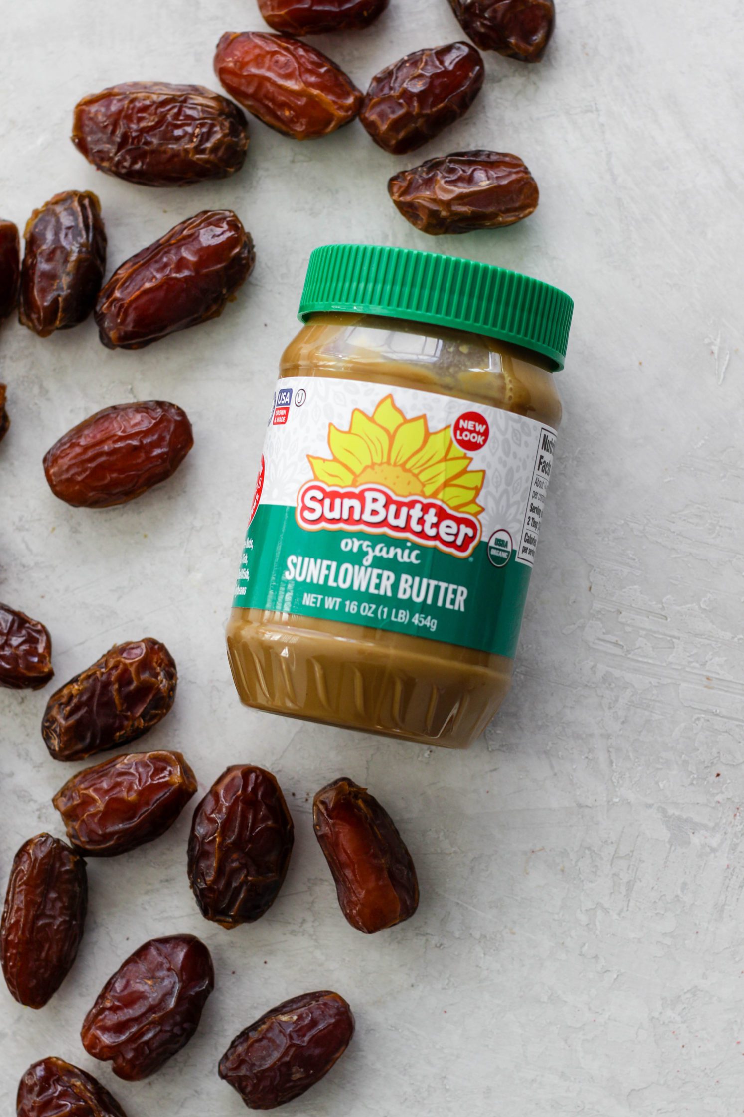 SunButter and medjool dates on wooden board by Flora & Vino 