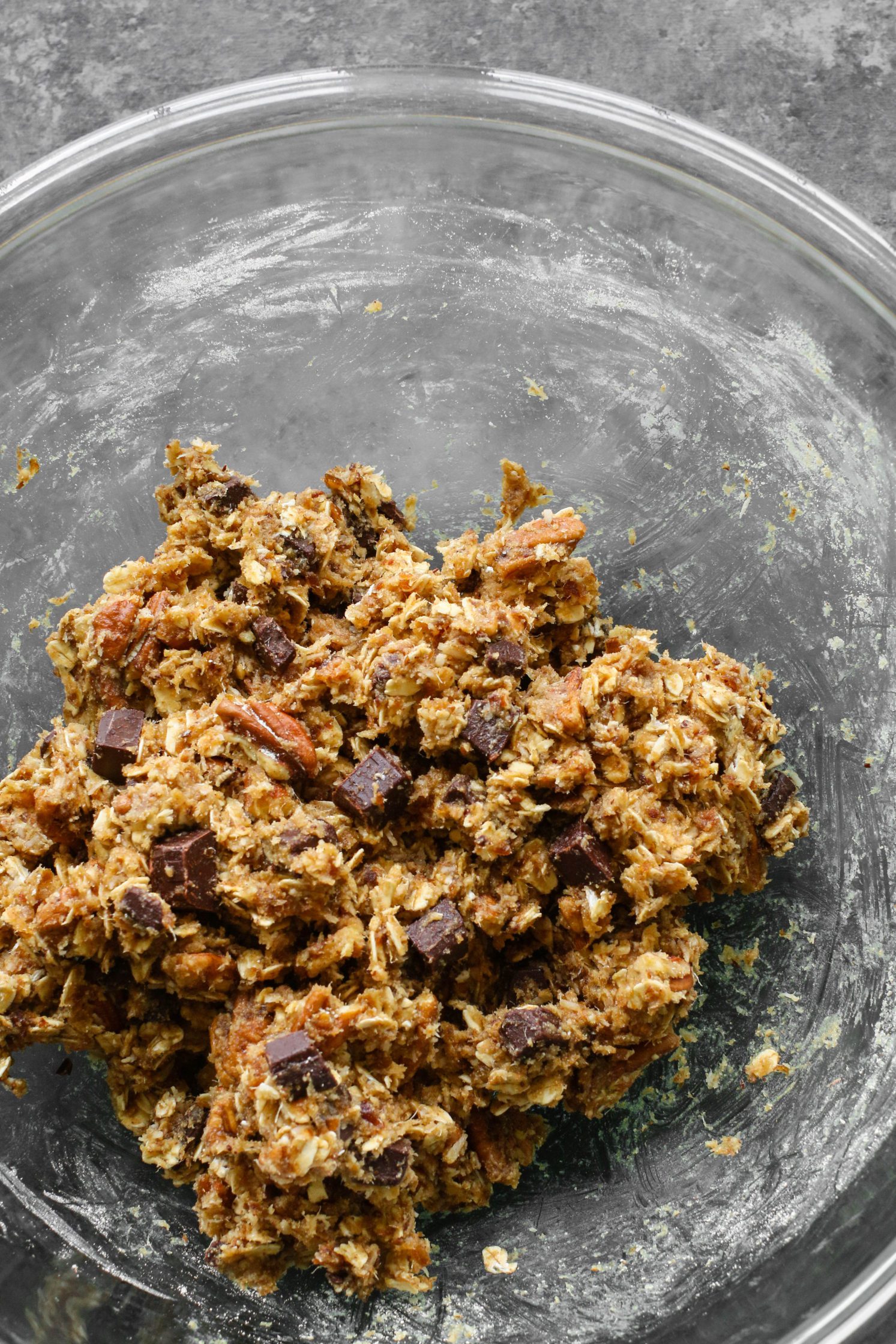 Healthy Magic Cookie Bars dough in mixing bowl by Flora & Vino 