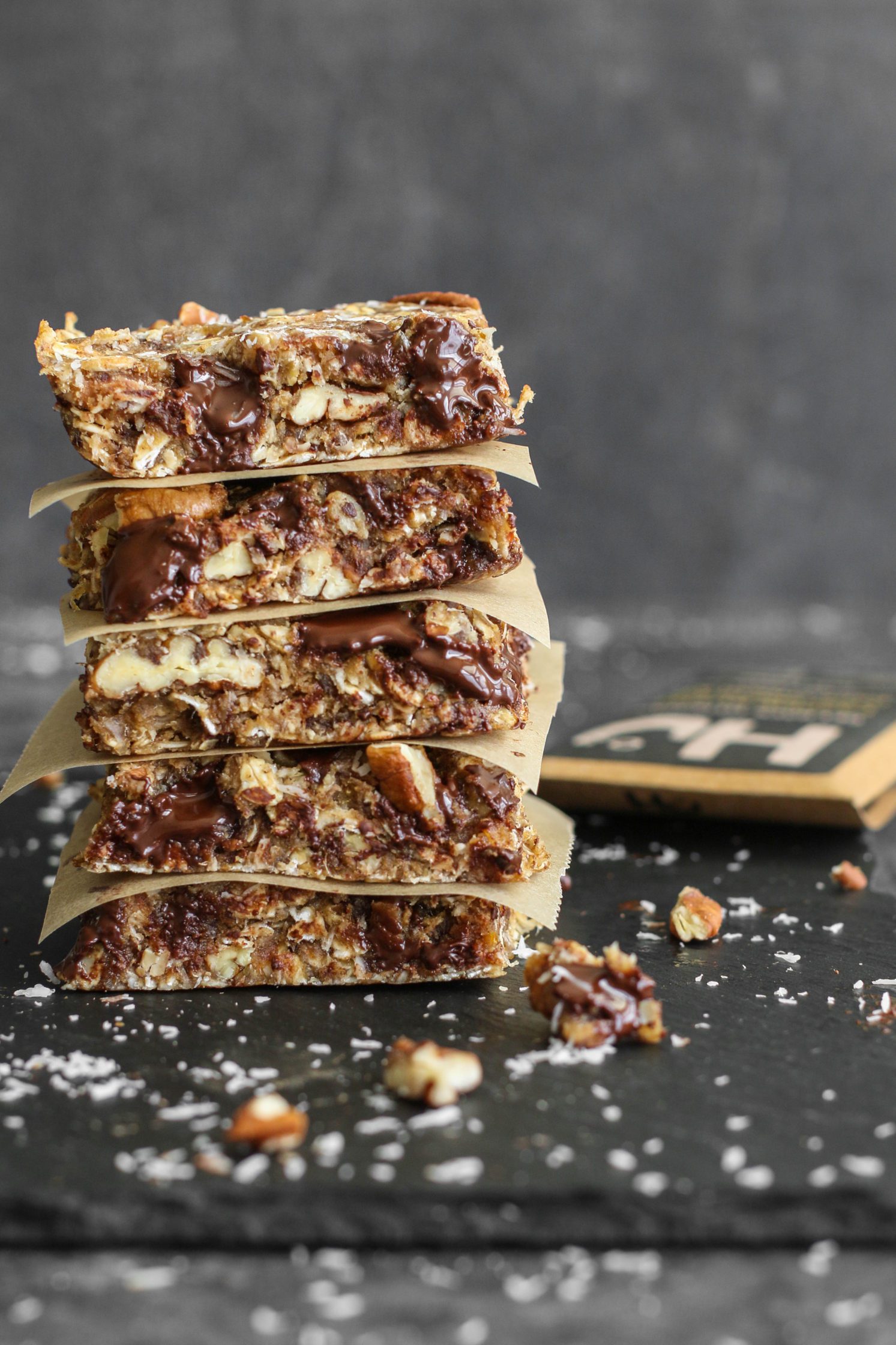 Healthy Magic Cookie Bars stacked on serving board by Flora & Vino 