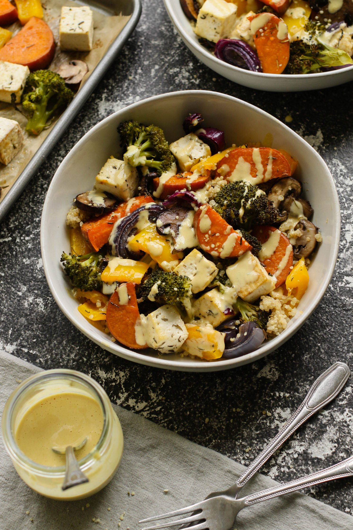 Tofu Sheet Pan Meal served with "Cheezy" Miso Tahini Sauce in bowls by Flora & Vino