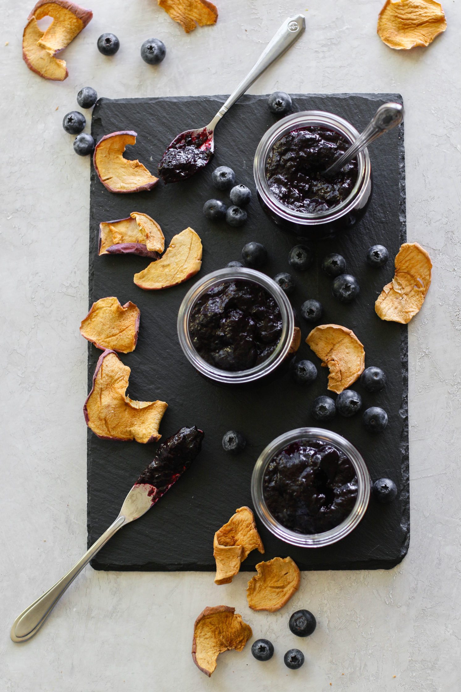 Blueberry Butter (No-Sugar-Added) in jars with apple chips by Flora & Vino 