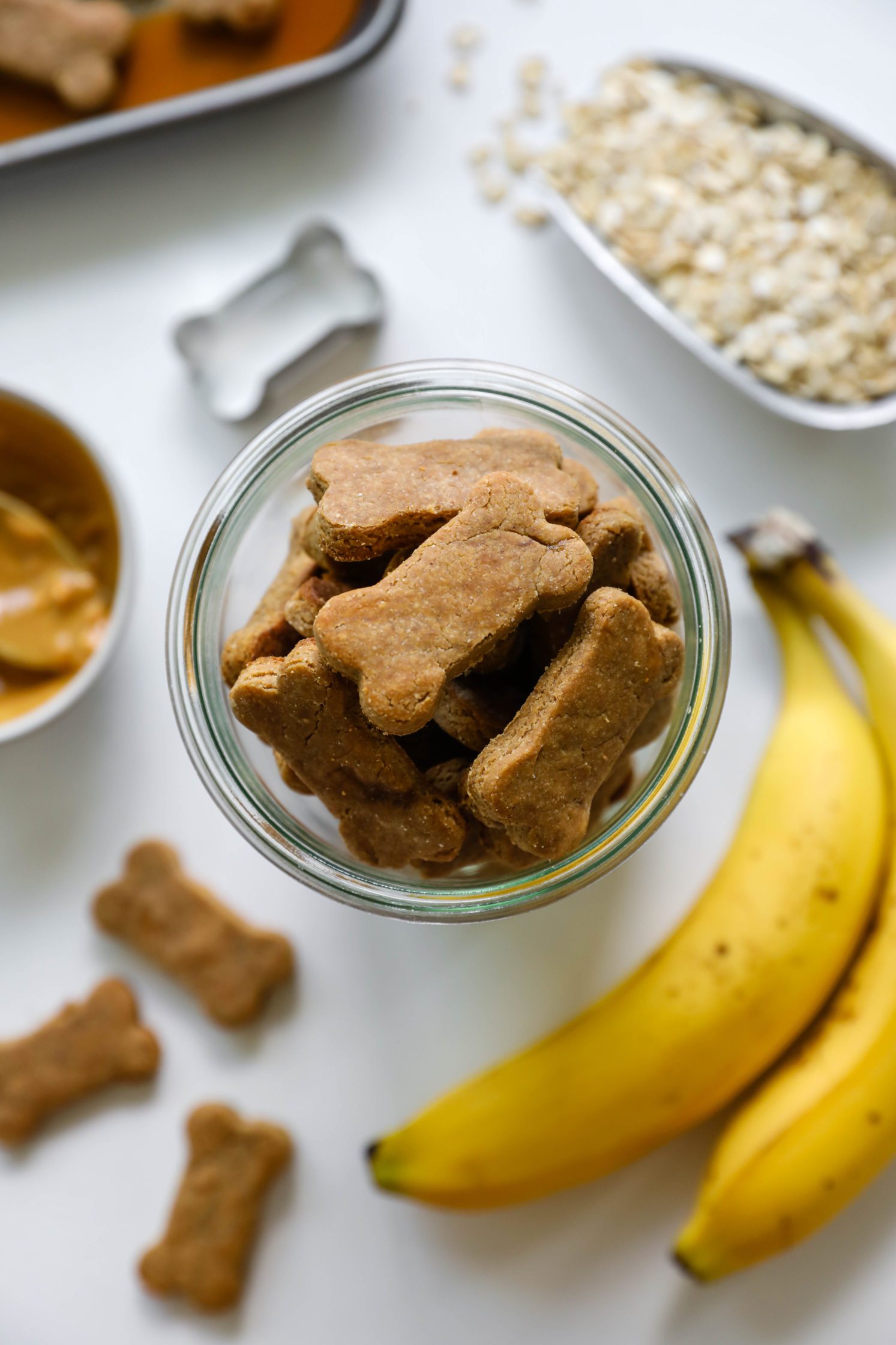 3-Ingredient Peanut Butter Banana Dog Treats in jar with oats, banana, and peanut butter