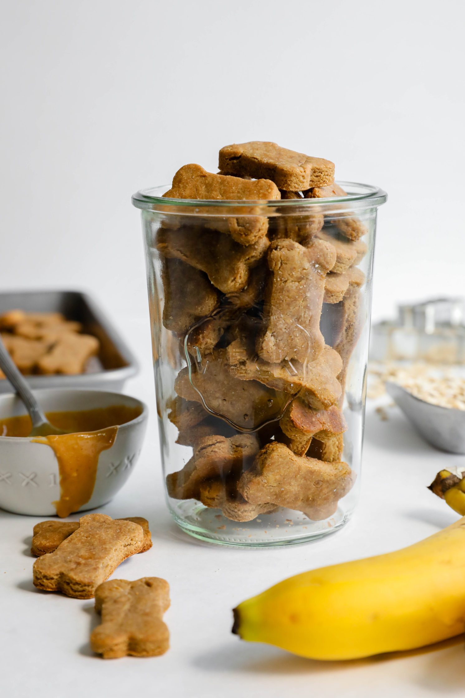 3-Ingredient Peanut Butter Banana Dog Treats in jar with oats, banana, and peanut butter
