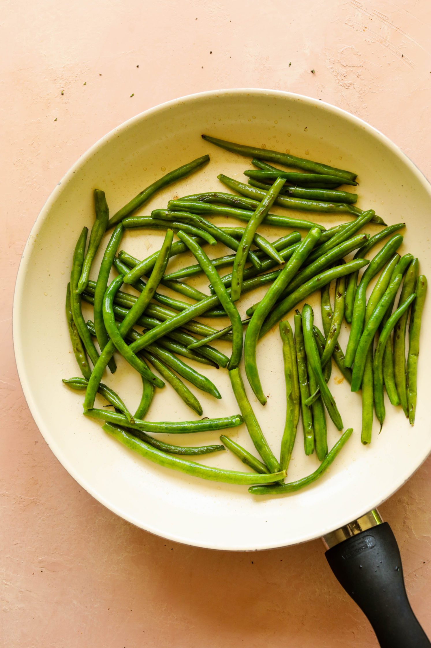 Sauteed Green Beans in white pan