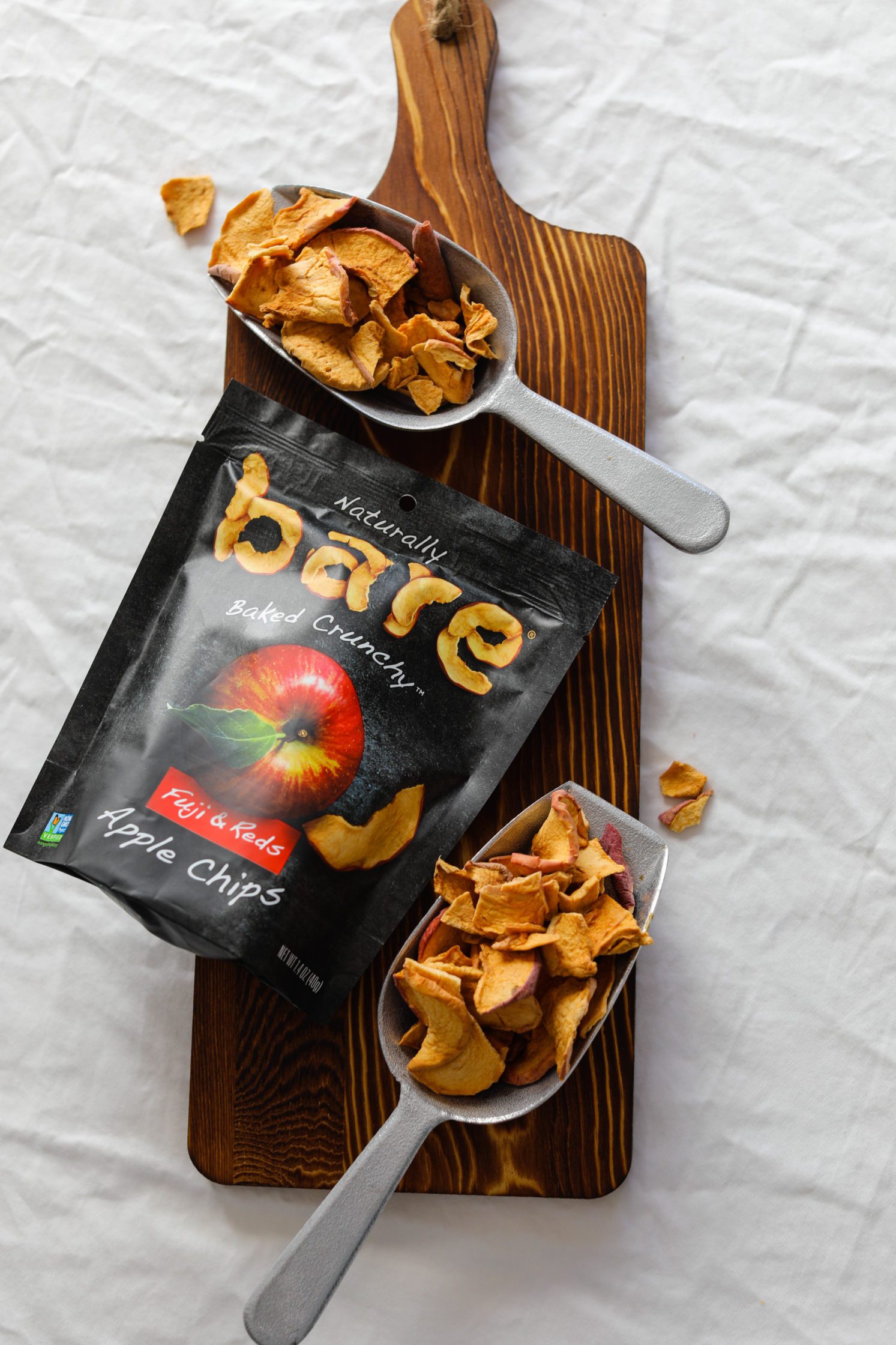 apple chips on wooden board