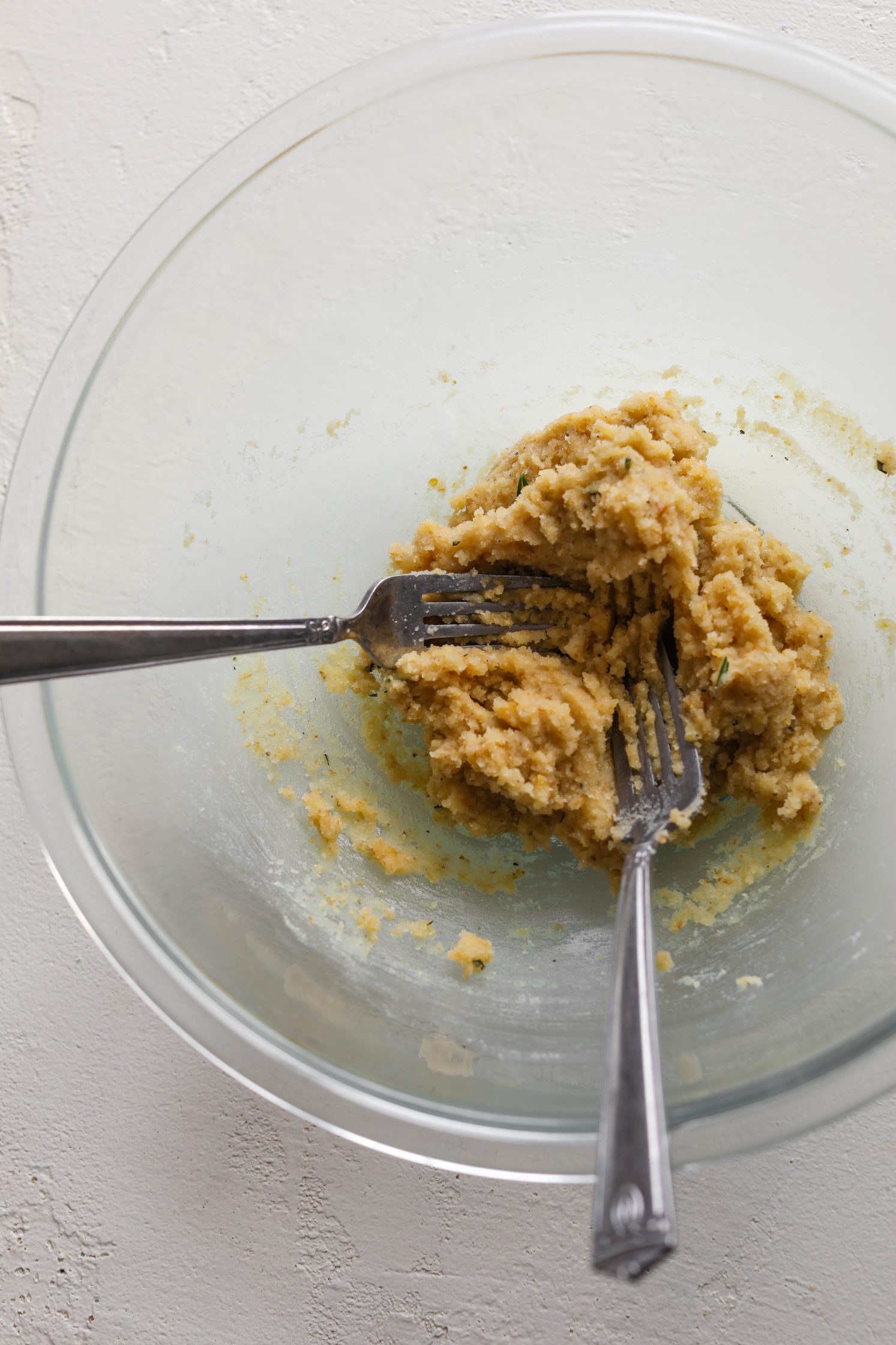 Grain-Free Almond Flour Cracker Dough mixed in bowl with two forks