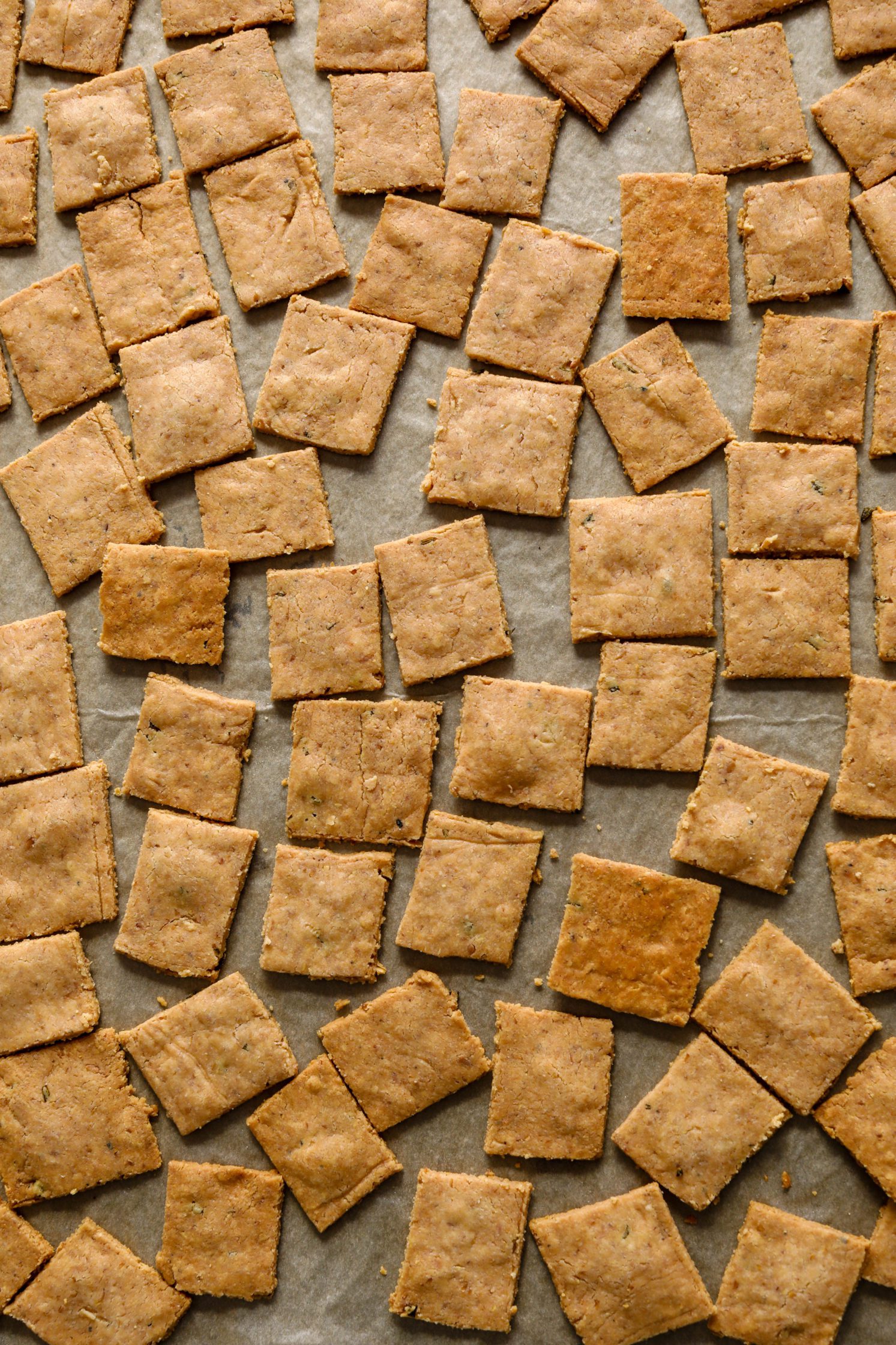 Grain-Free Almond Flour Crackers baked on parchment lined baking sheet