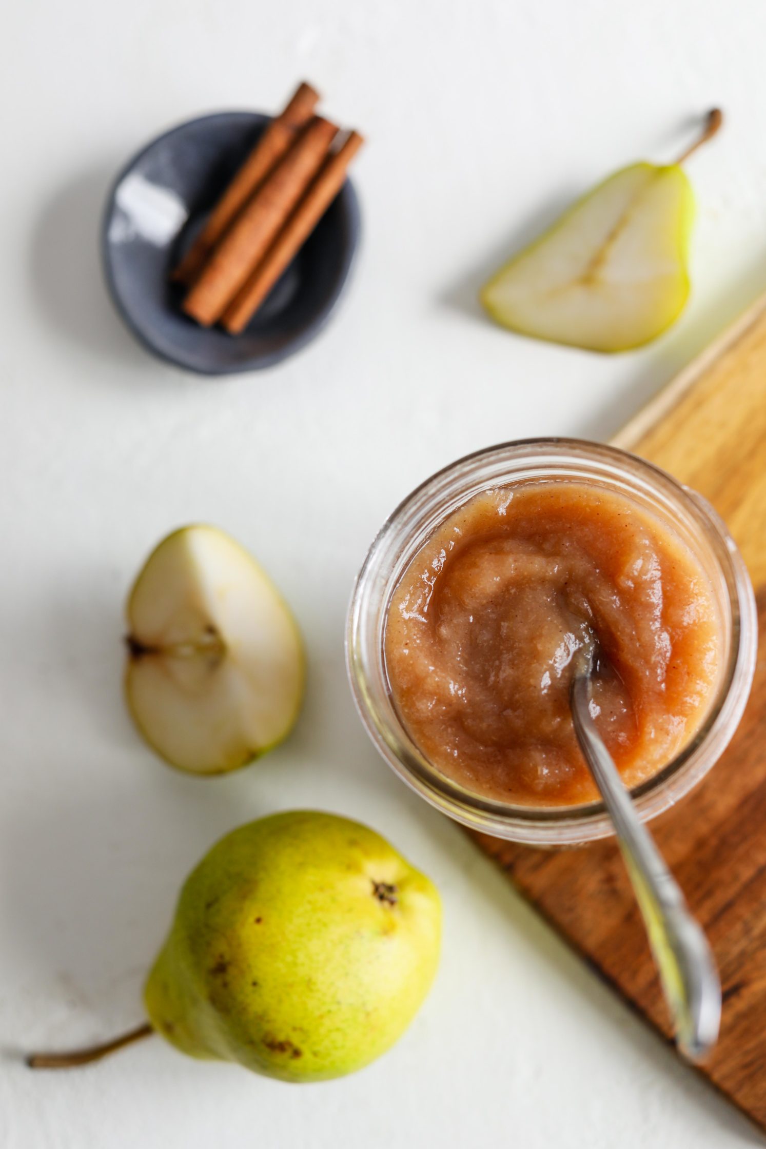 Maple Pear Butter served in mason jar with a spoon by Flora & Vino