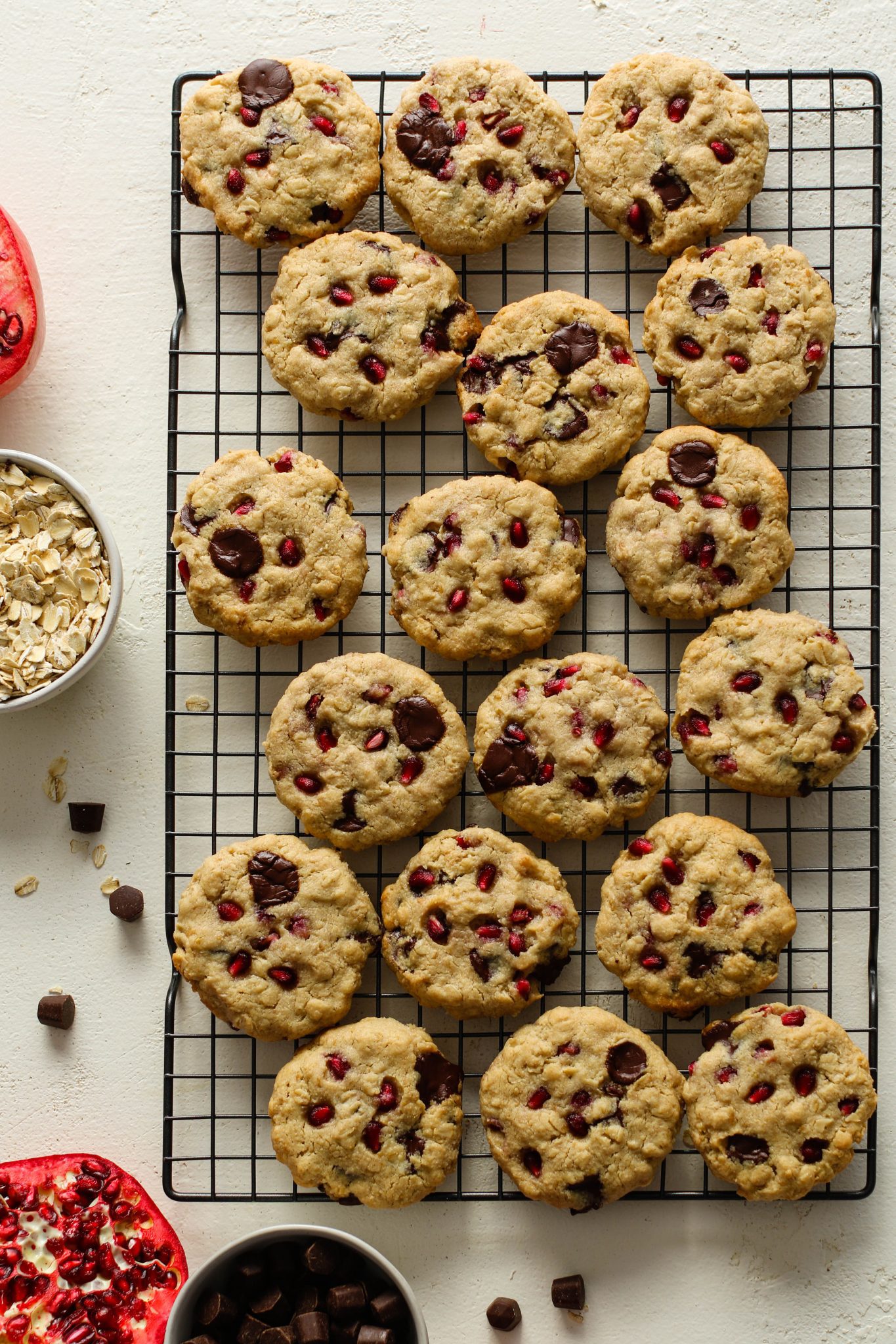 Pomegranate Oatmeal Chocolate Chip Cookies on cooling rack by Flora & Vino 