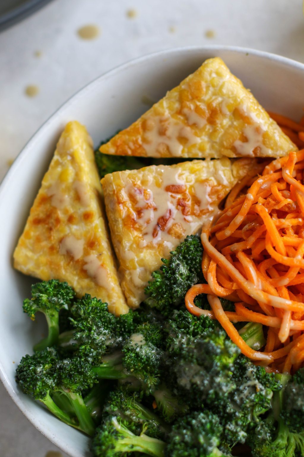Tahini Tempeh, Sweet Potato Noodle, & Broccoli Bowl Flora & Vino