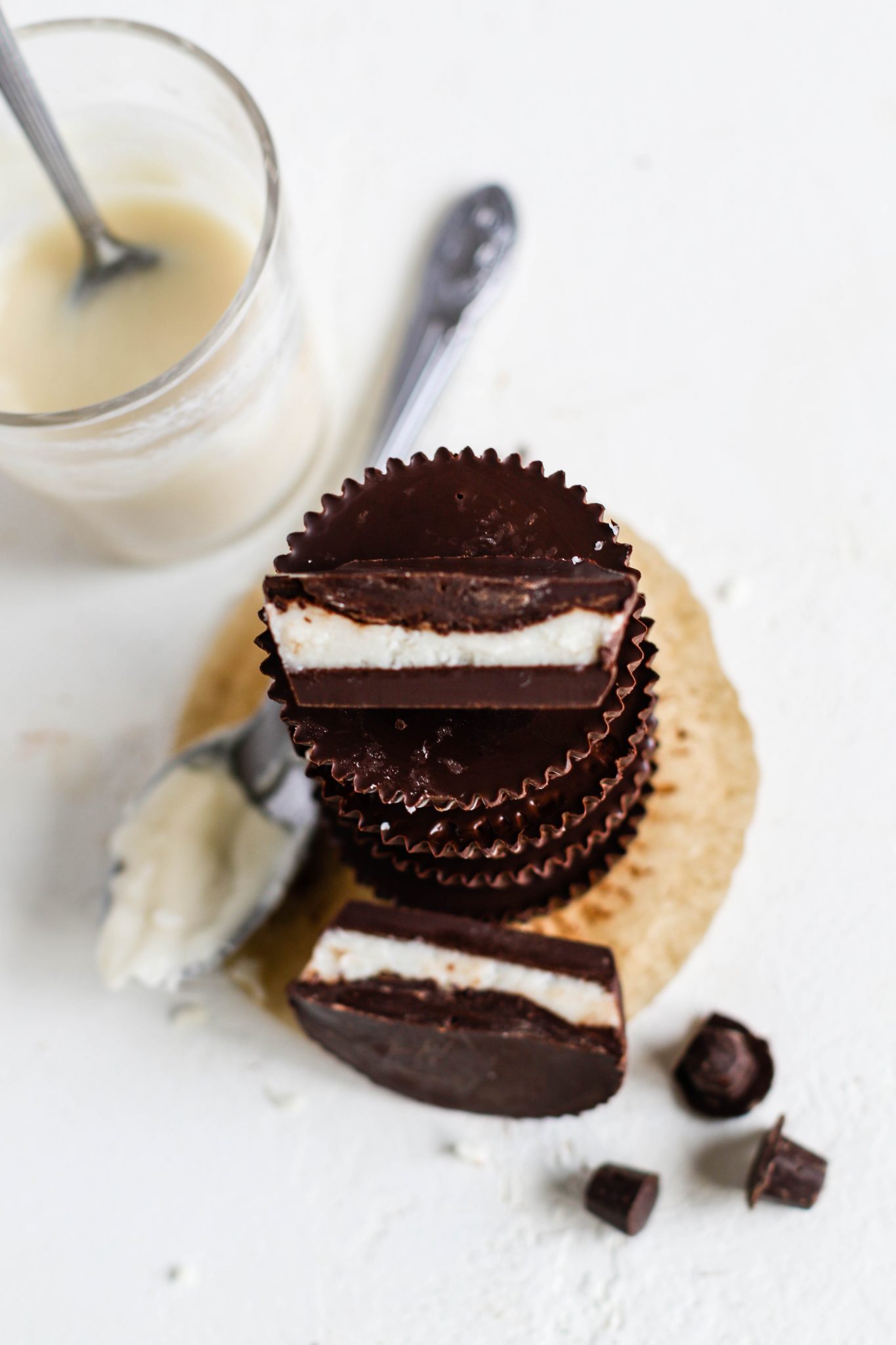 Dark Chocolate Coconut Butter Cup stacked and sliced in half by Flora & Vino