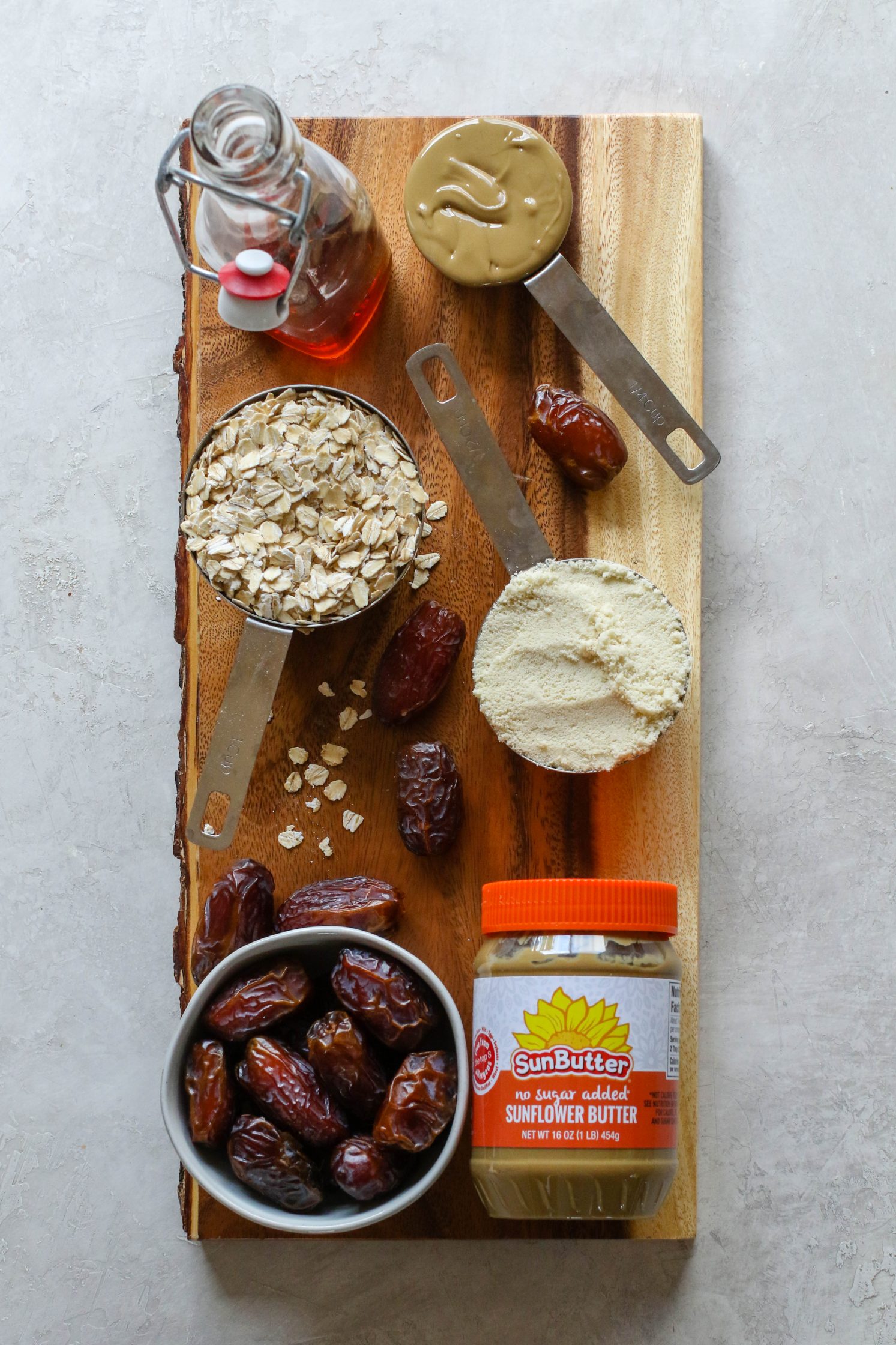 baking ingredients on wooden board with SunButter by Flora & Vino