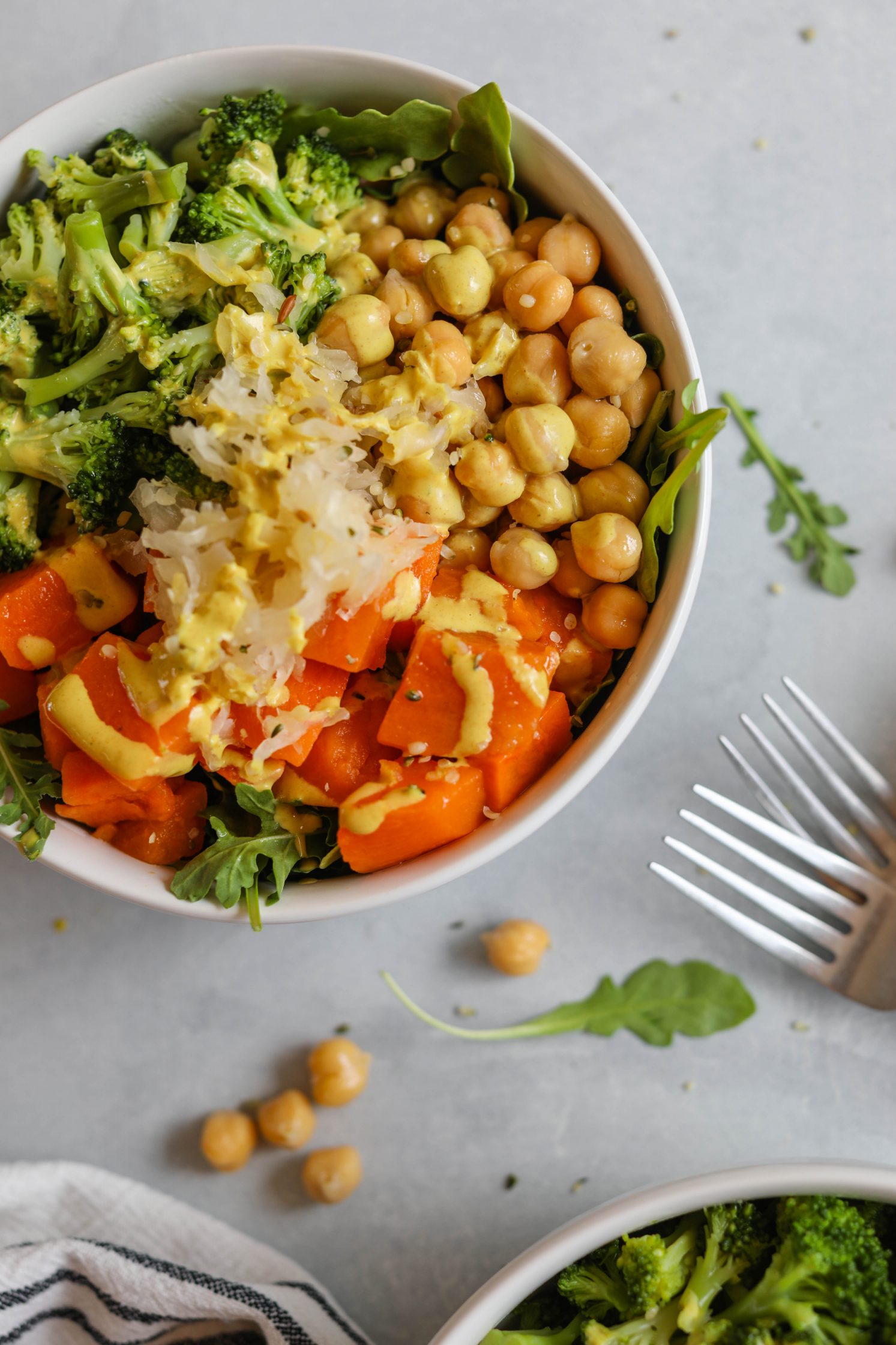 Chickpea Meal Prep Bowl served with with Turmeric Tahini Dressing and forks by Flora & Vino 