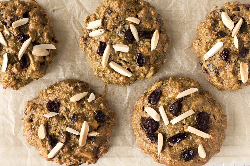 Cranberry Almond Breakfast Cookies on parchment paper by Flora & Vino 