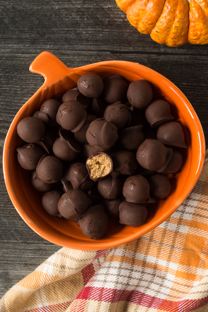 Vegan Peanut Butter Chocolate Balls in orange pumpkin bowl by Flora & Vino