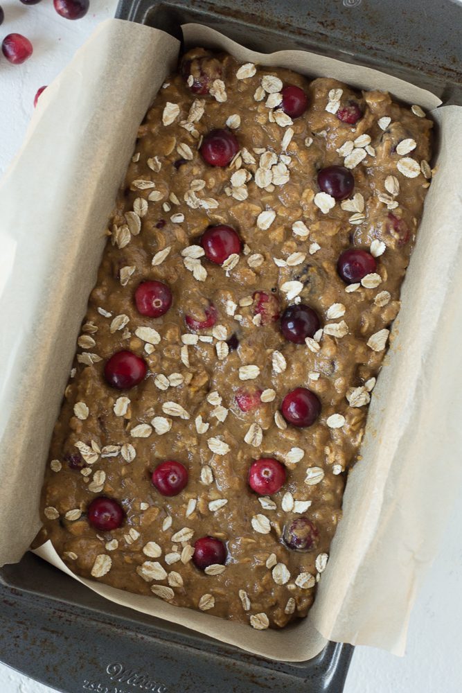 1-Bowl Orange Cranberry Bread in parchment lined bread pan by Flora & Vino