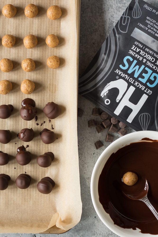 Vegan Peanut Butter balls dipped in melted chocolate by Flora & Vino