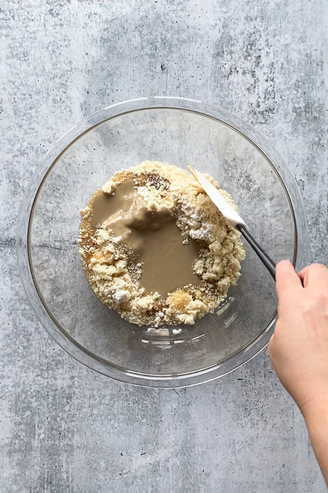 cookie batter in bowl with a spatula by Flora & Vino