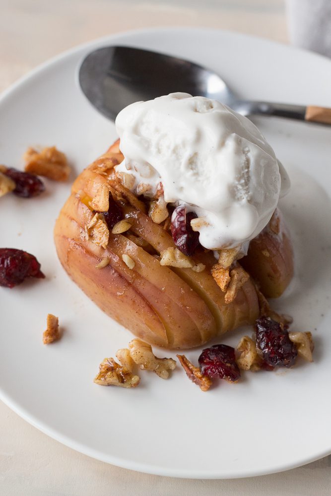 Hasselback Baked Apples served with ice cream and a spoon by Flora & Vino 