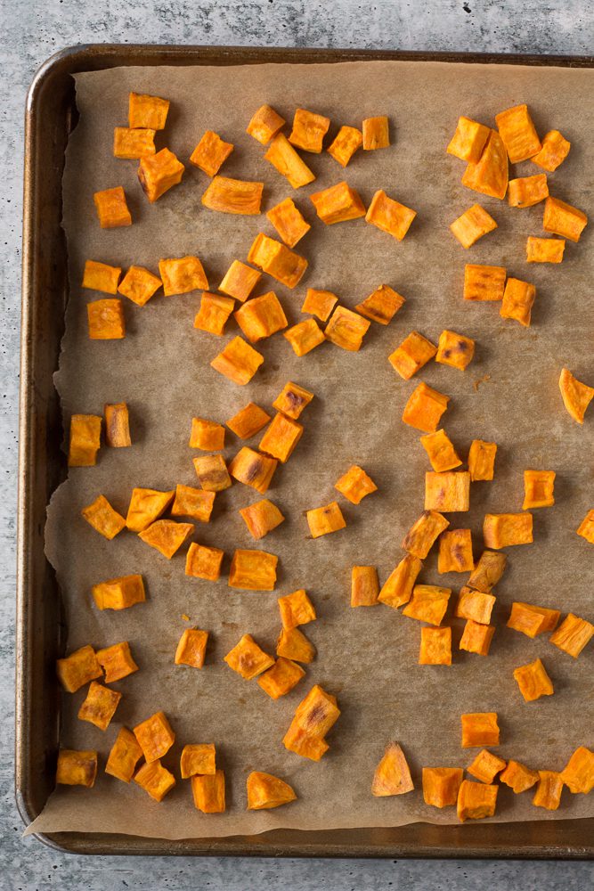 diced sweet potatoes roasted on sheet pan by Flora & Vino
