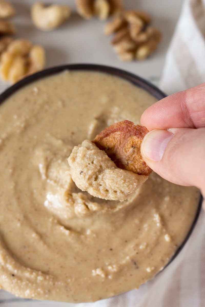 Banana Chips scooping up Raw Walnut Cashew Butter by Flora & Vino 