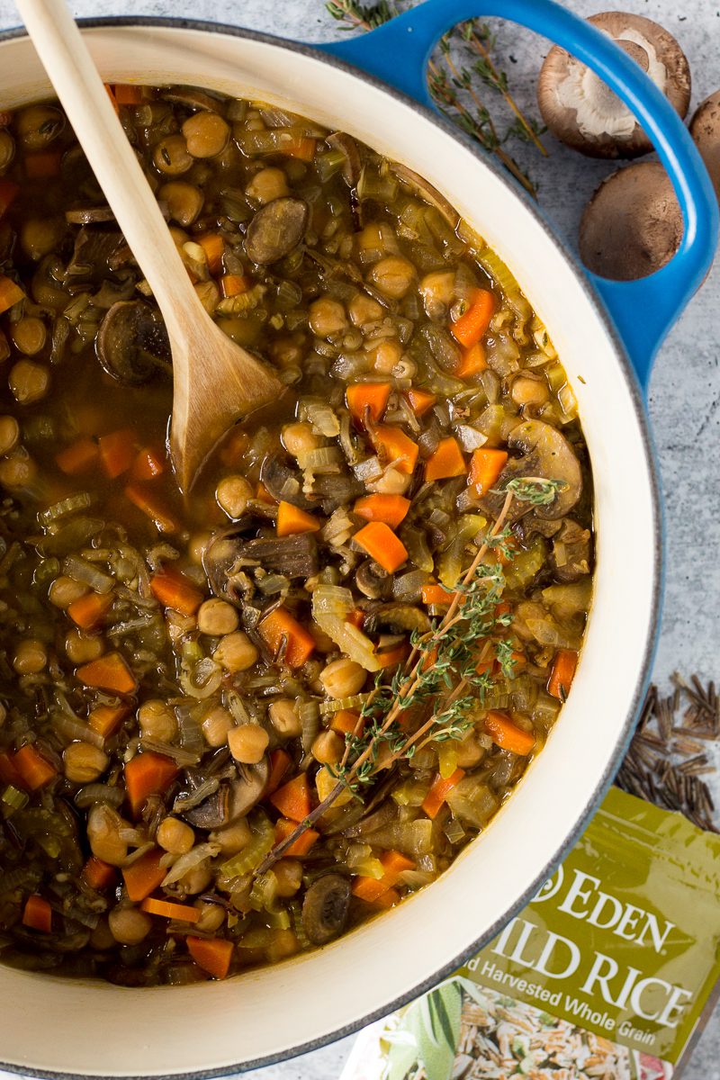 Chickpea & Wild Rice Soup in stock pot with wooden spoon by Flora & Vino 