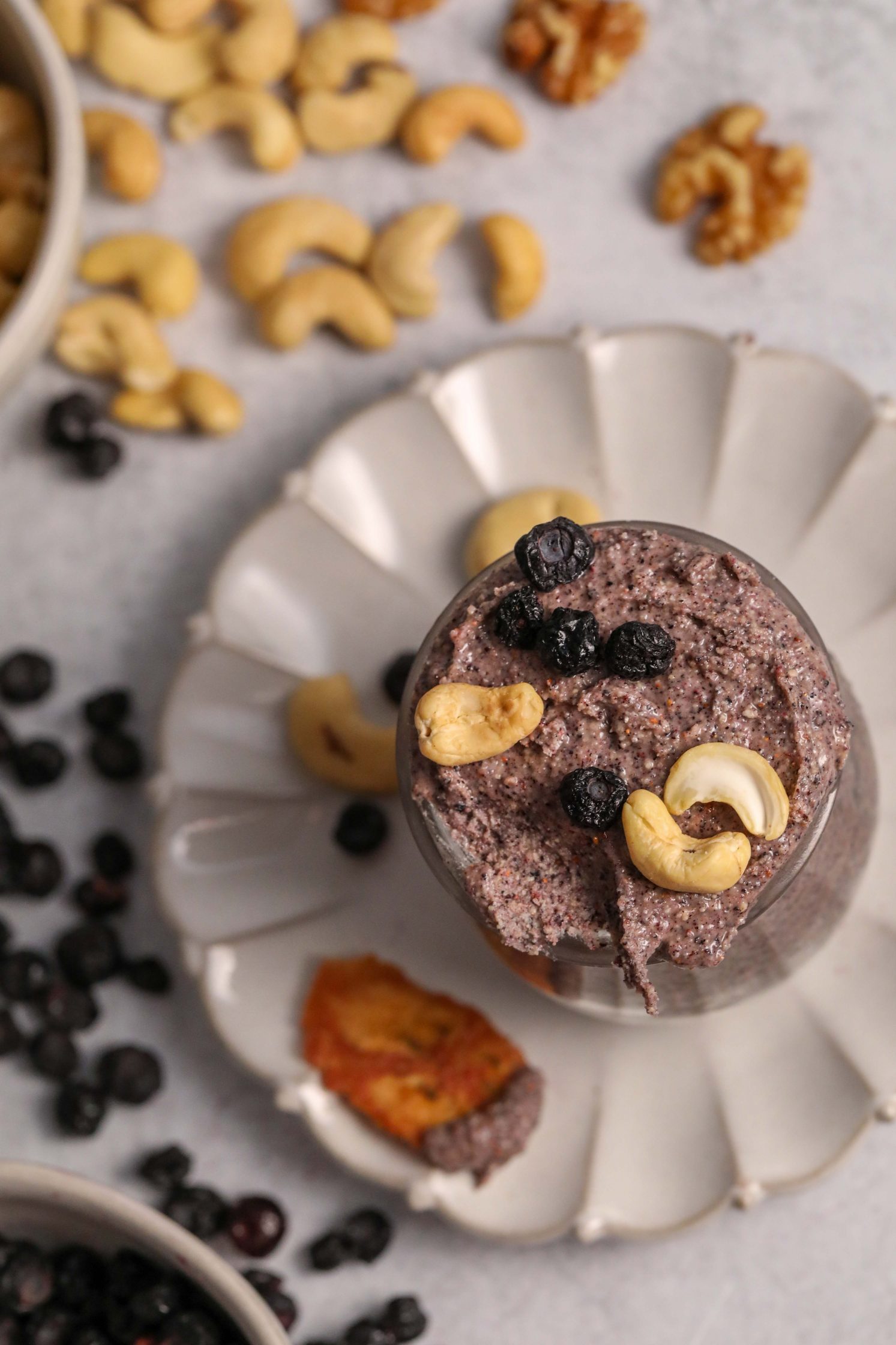 Blueberry Cashew Butter in mason jar topped with freeze-dried blueberries and cashews
