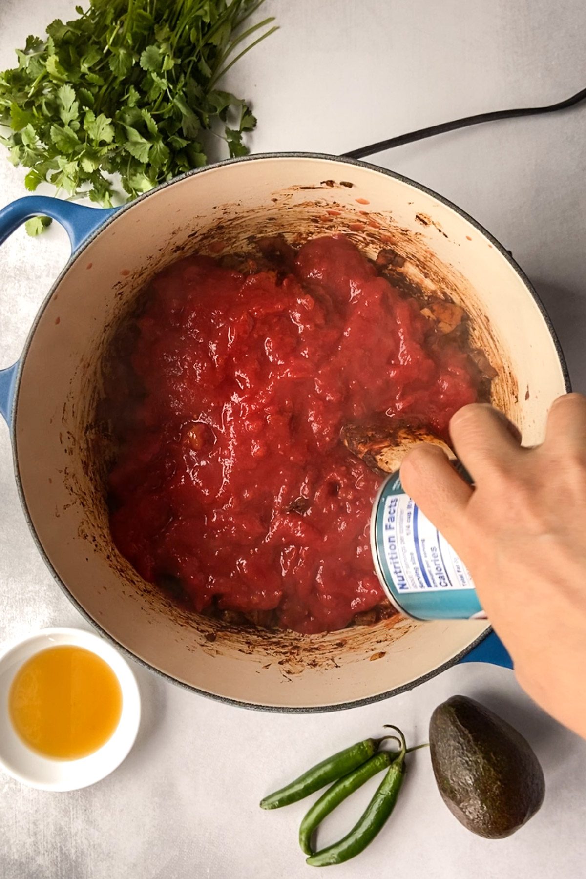  adding tomato sauce to Vegan Chocolate Chili by Flora & Vino
