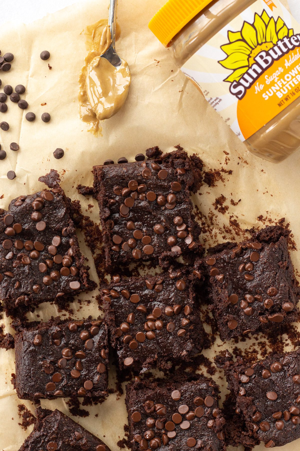 Sweet Potato SunButter Brownies cut into squares with SunButter spoon by Flora & Vino