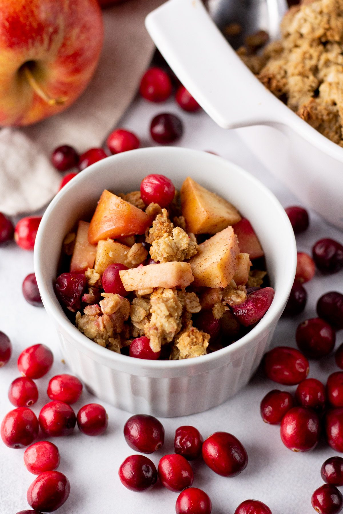 Cranberry Apple Crumble served in ramekin with cranberries and apples by Flora & Vino
