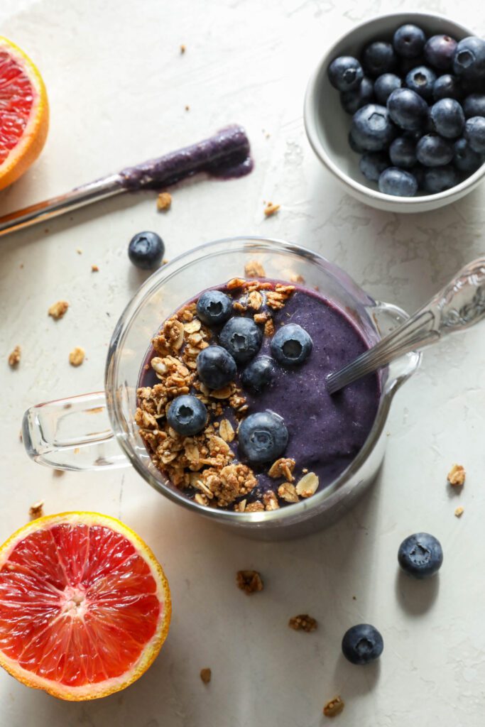 Blood Orange Beet Shake served overhead with blueberries and granola on top by Flora & Vino