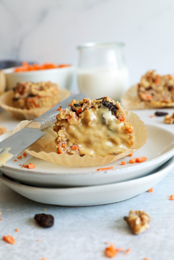 Carrot Cake Almond Flour Muffin halved and smeared with nut butter on two plates