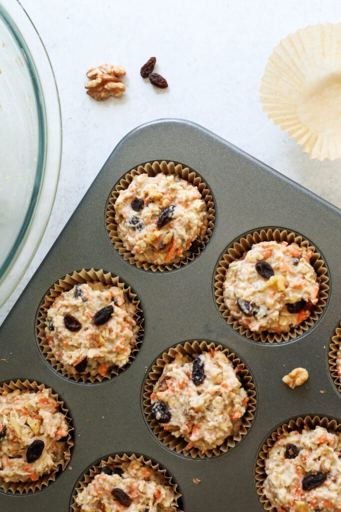 Carrot Cake Almond Flour Muffin batter in muffin baking tin 