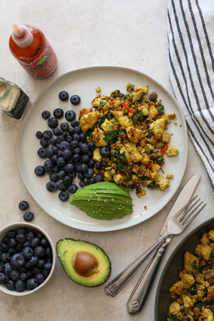 Easy Tofu Scramble Plate served with blueberries and avocado by Flora & Vino