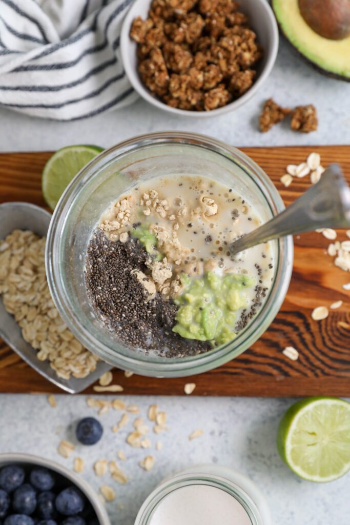Key Lime Pie Overnight Oats ingredients mixed in mason jar by Flora & Vino